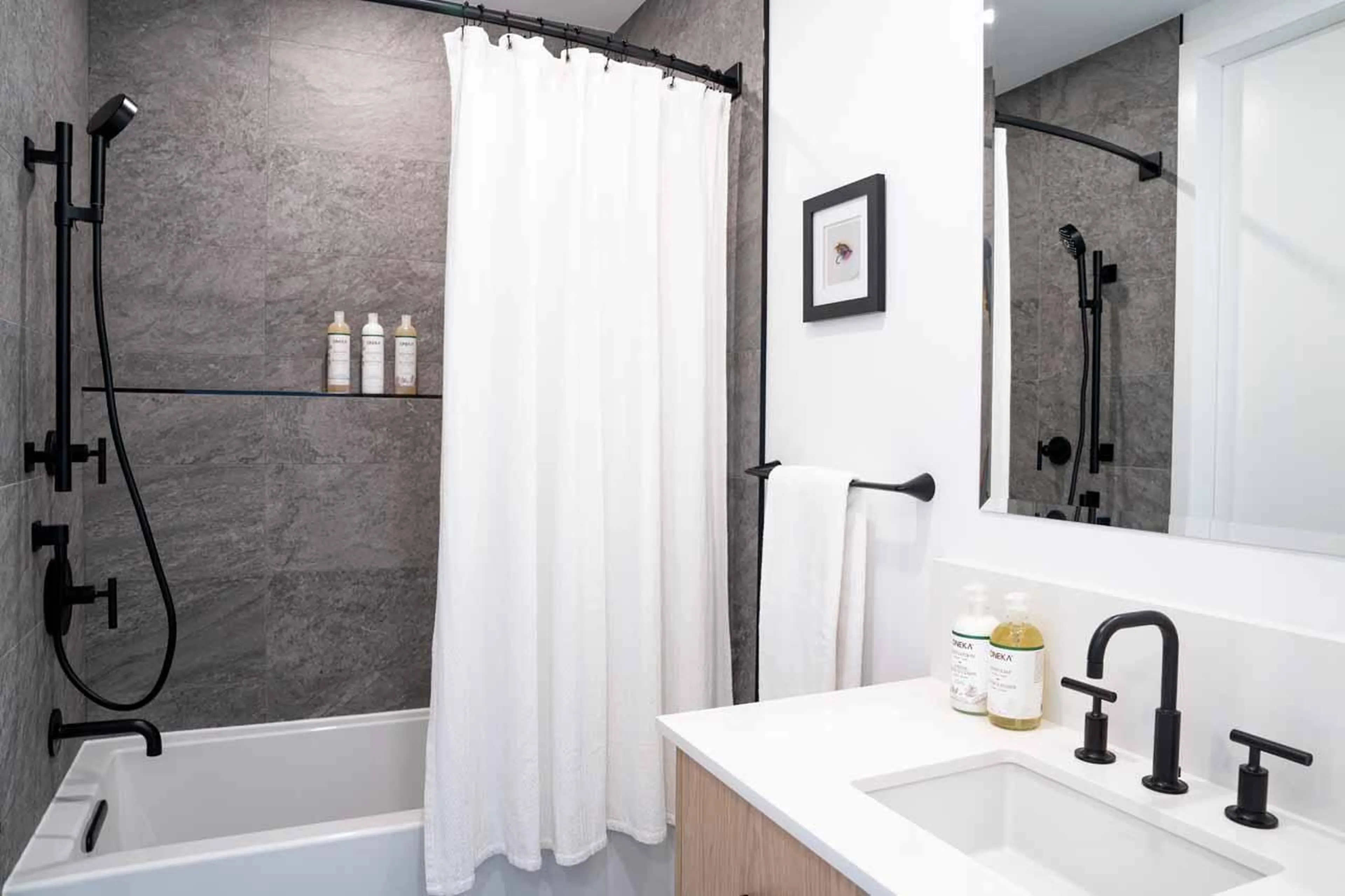 En-suite bathroom with rain shower at Arrowhead Lodge in Revelstoke