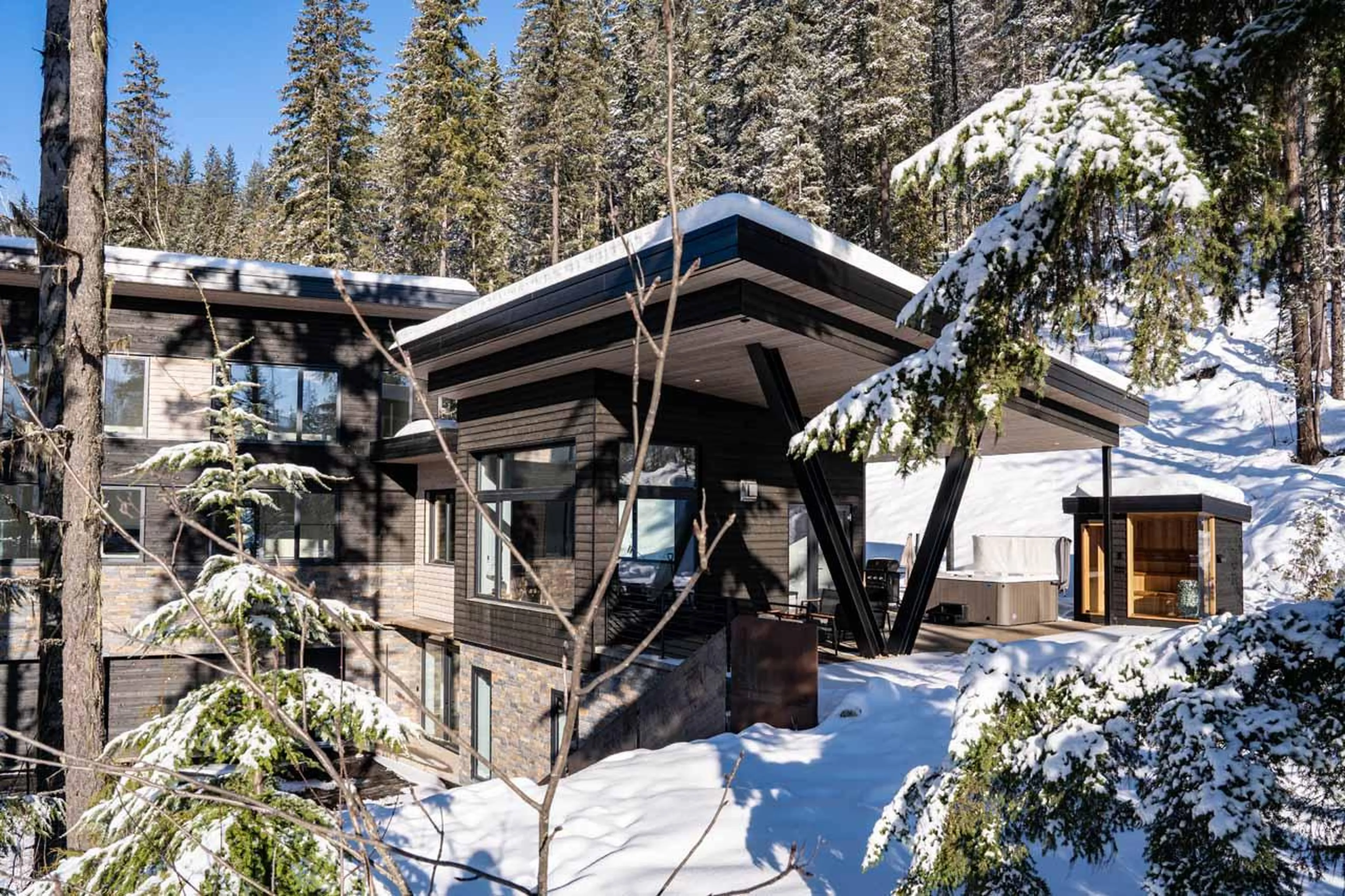 Chalet exterior with patio space at Arrowhead Lodge in Revelstoke