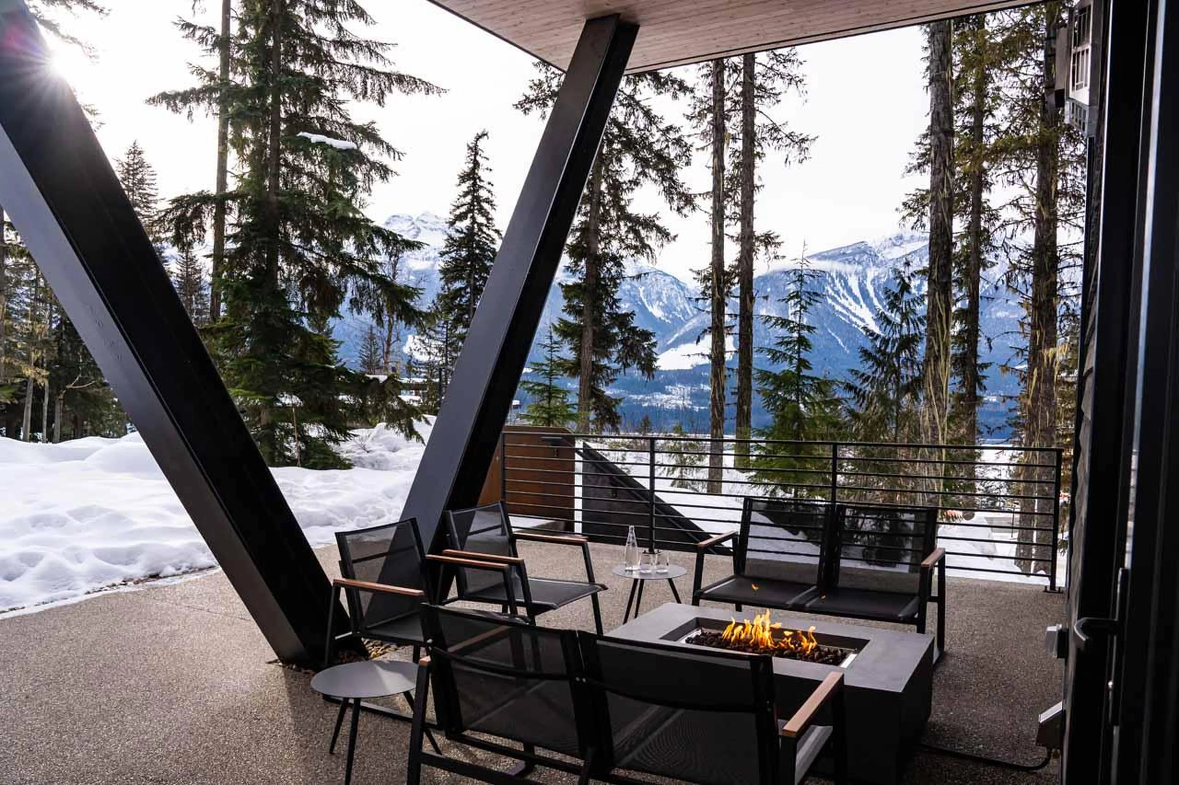 Outdoor seating on side patio at Arrowhead Lodge in Revelstoke