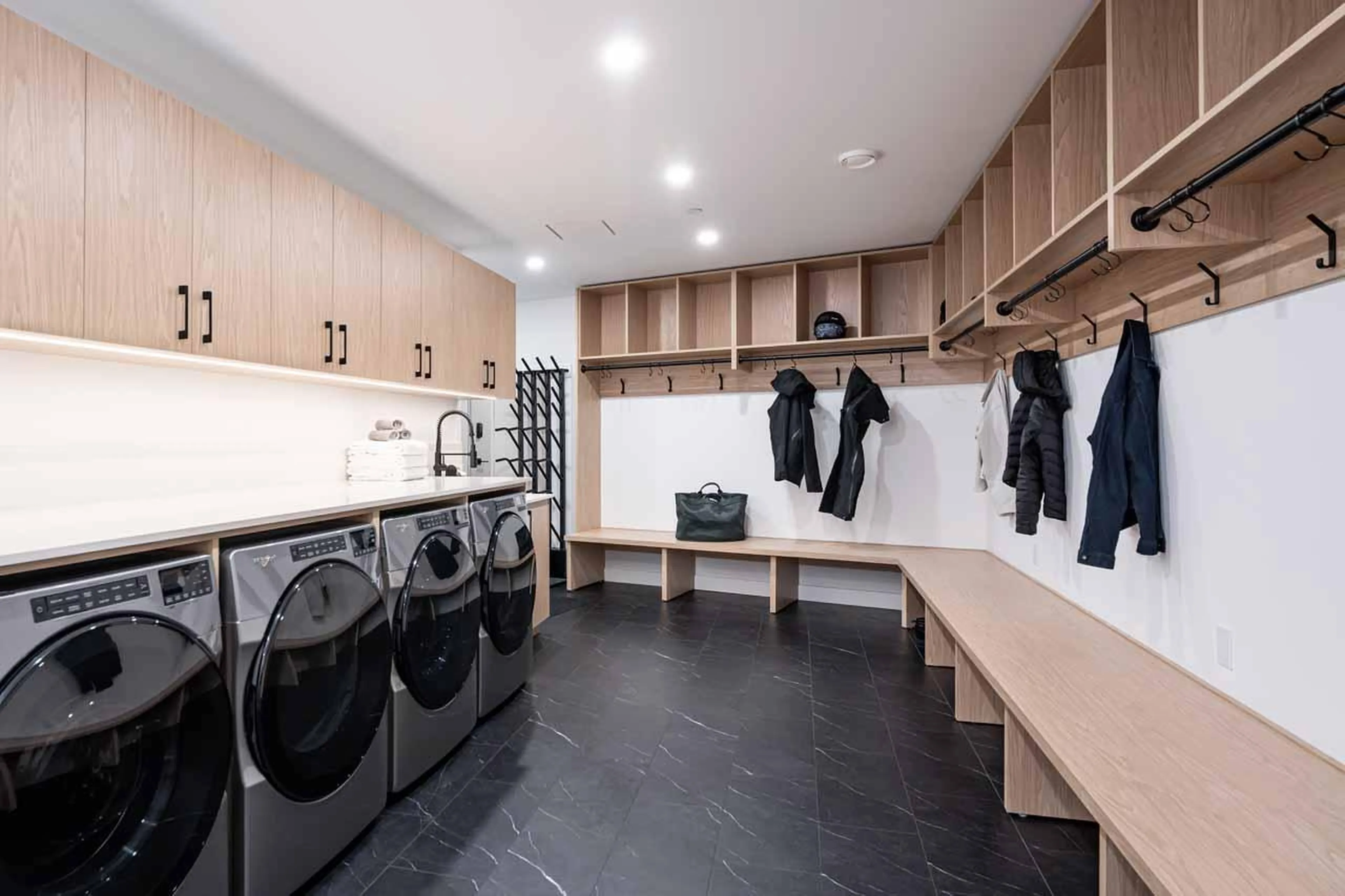 Laundry and ski room with plentiful storage space at Arrowhead Lodge in Revelstoke