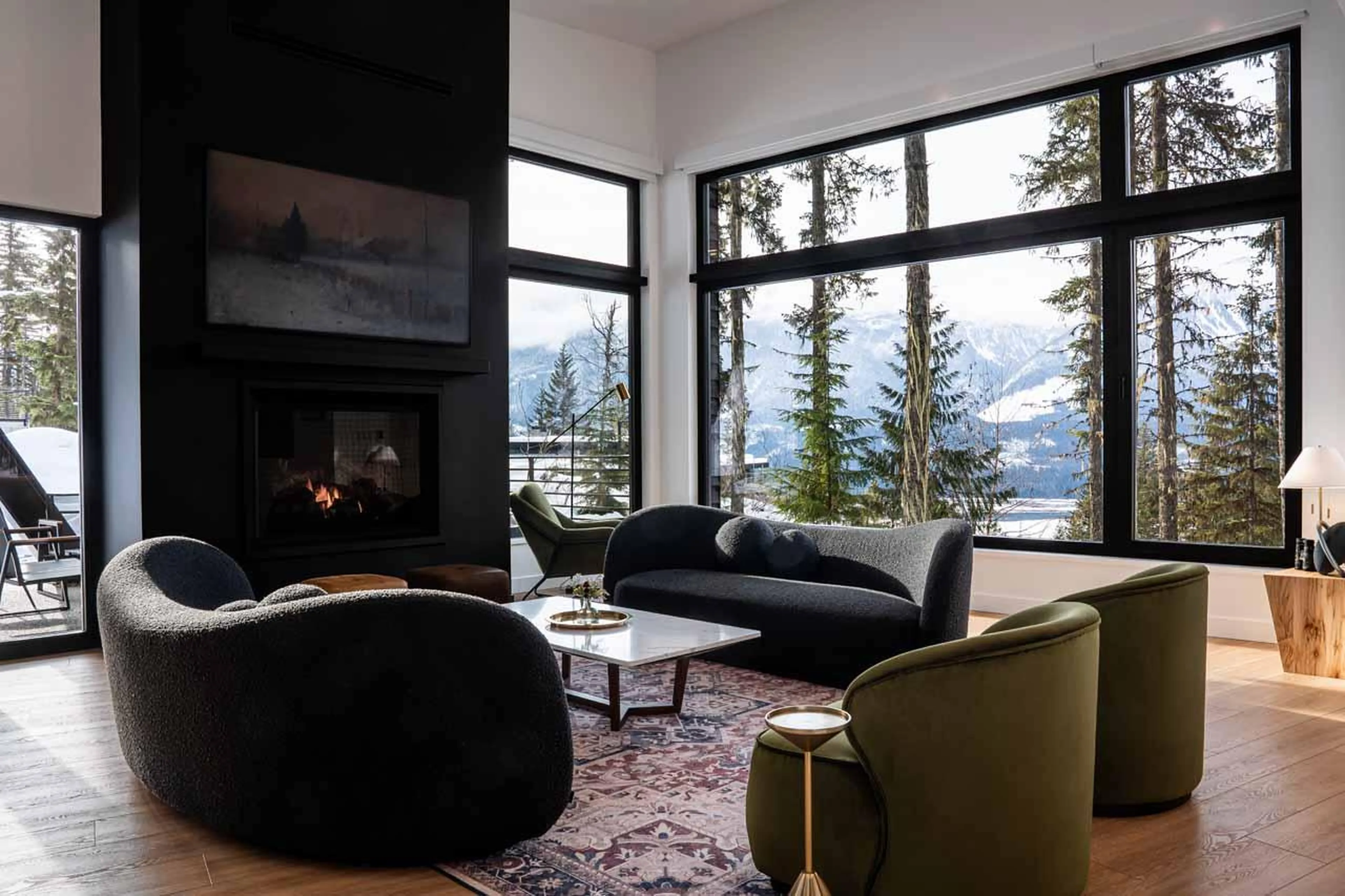 Modern sofa space with gas fireplace and smart TV at Arrowhead Lodge in Revelstoke