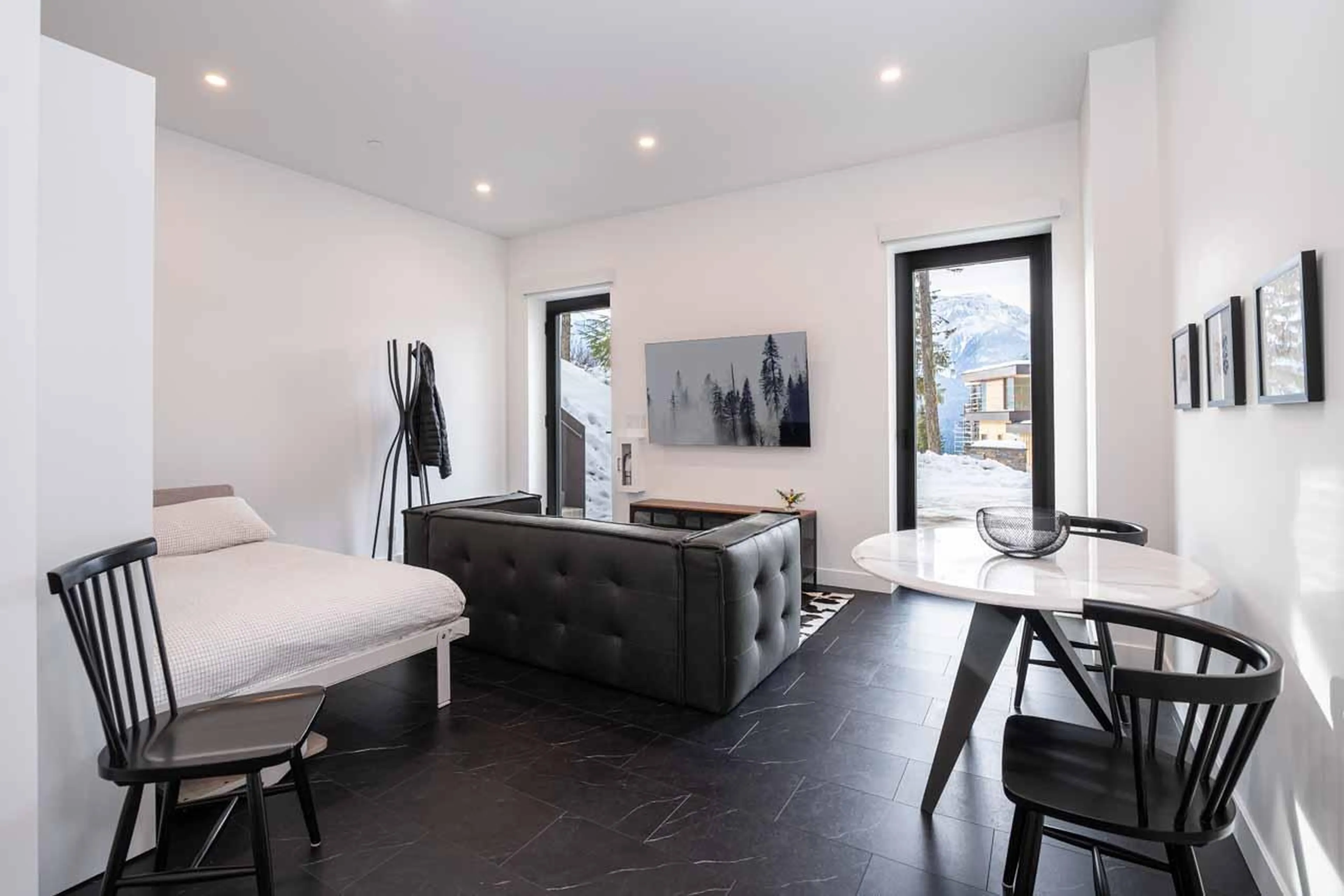 Bedroom suite with TV lounge at Arrowhead Lodge in Revelstoke