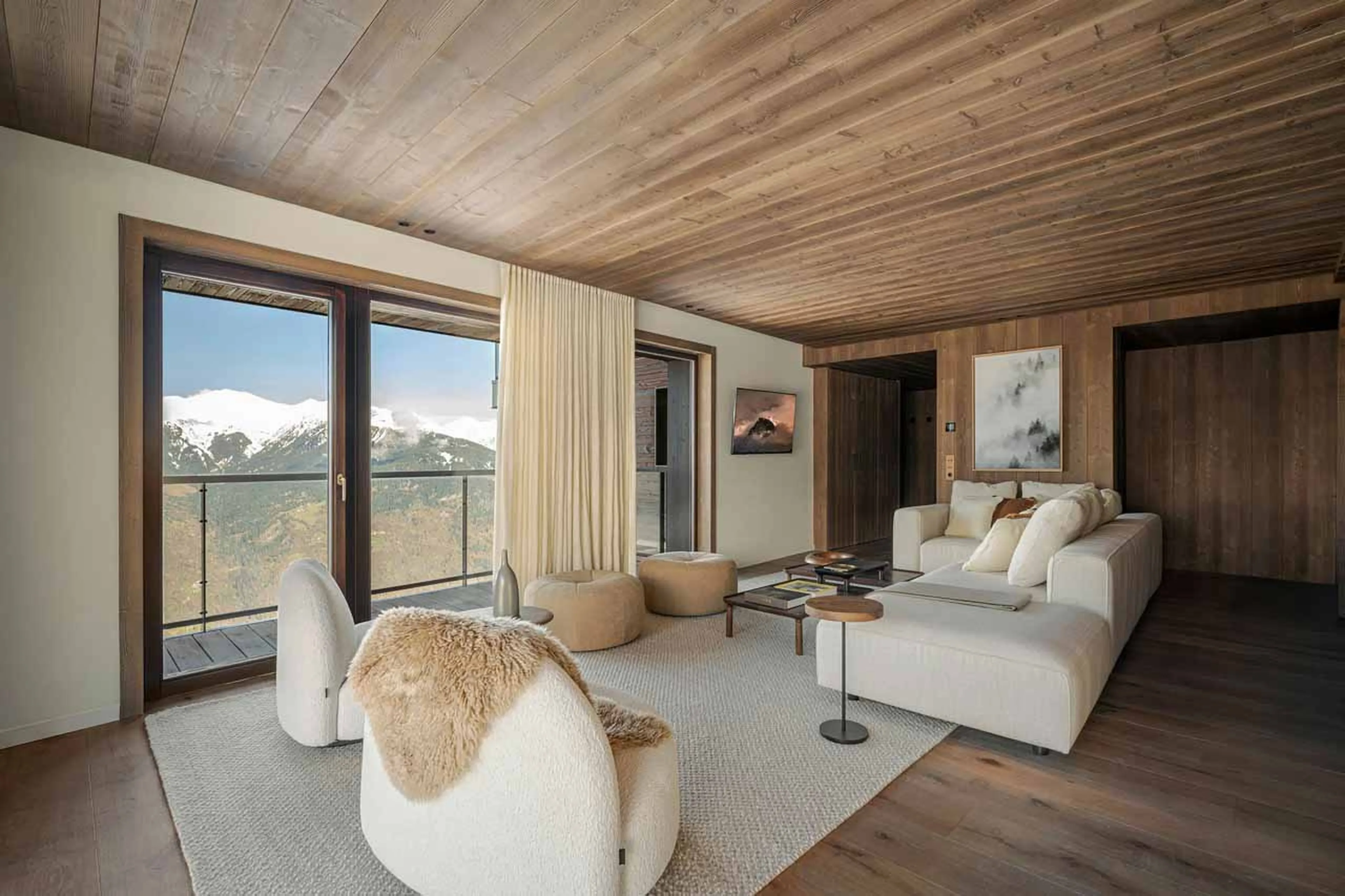 Sofas and armchairs in living area of Atmosphere 302 in Courchevel 1850