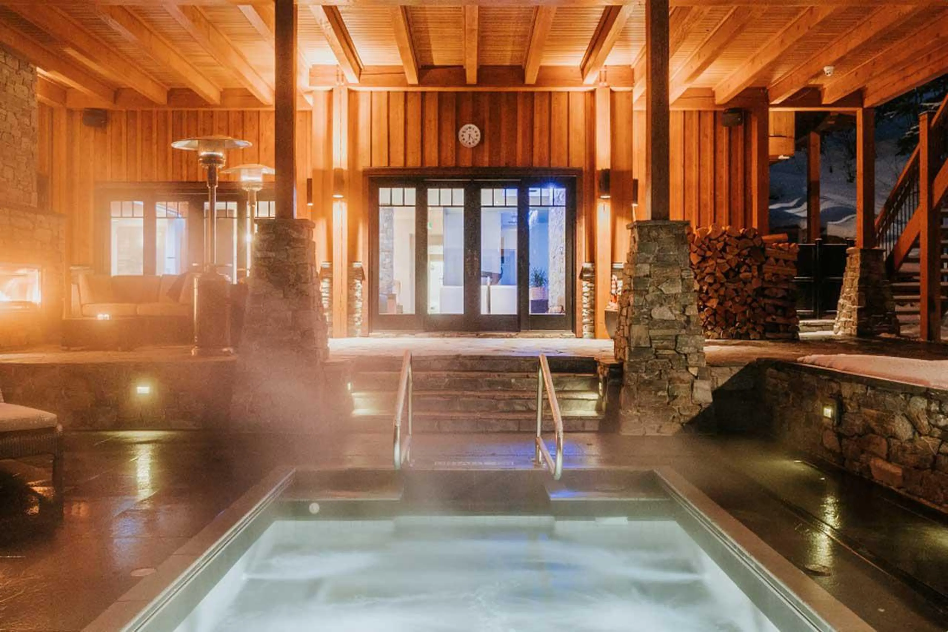 Outdoor hot tub at night at Bighorn in Revelstoke