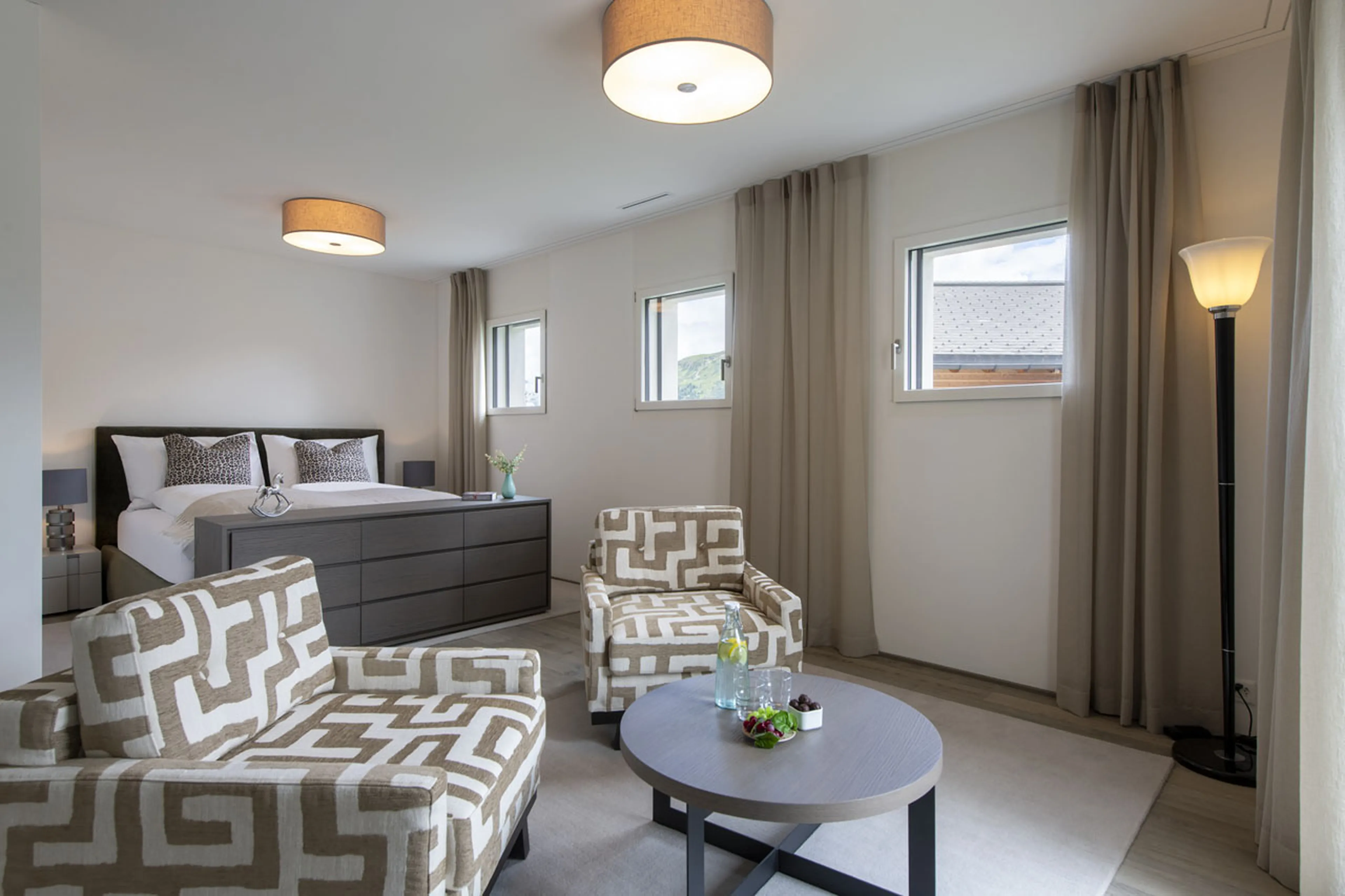 Double bedroom with seating at Buelenhorn in Bortji Estate in Davos