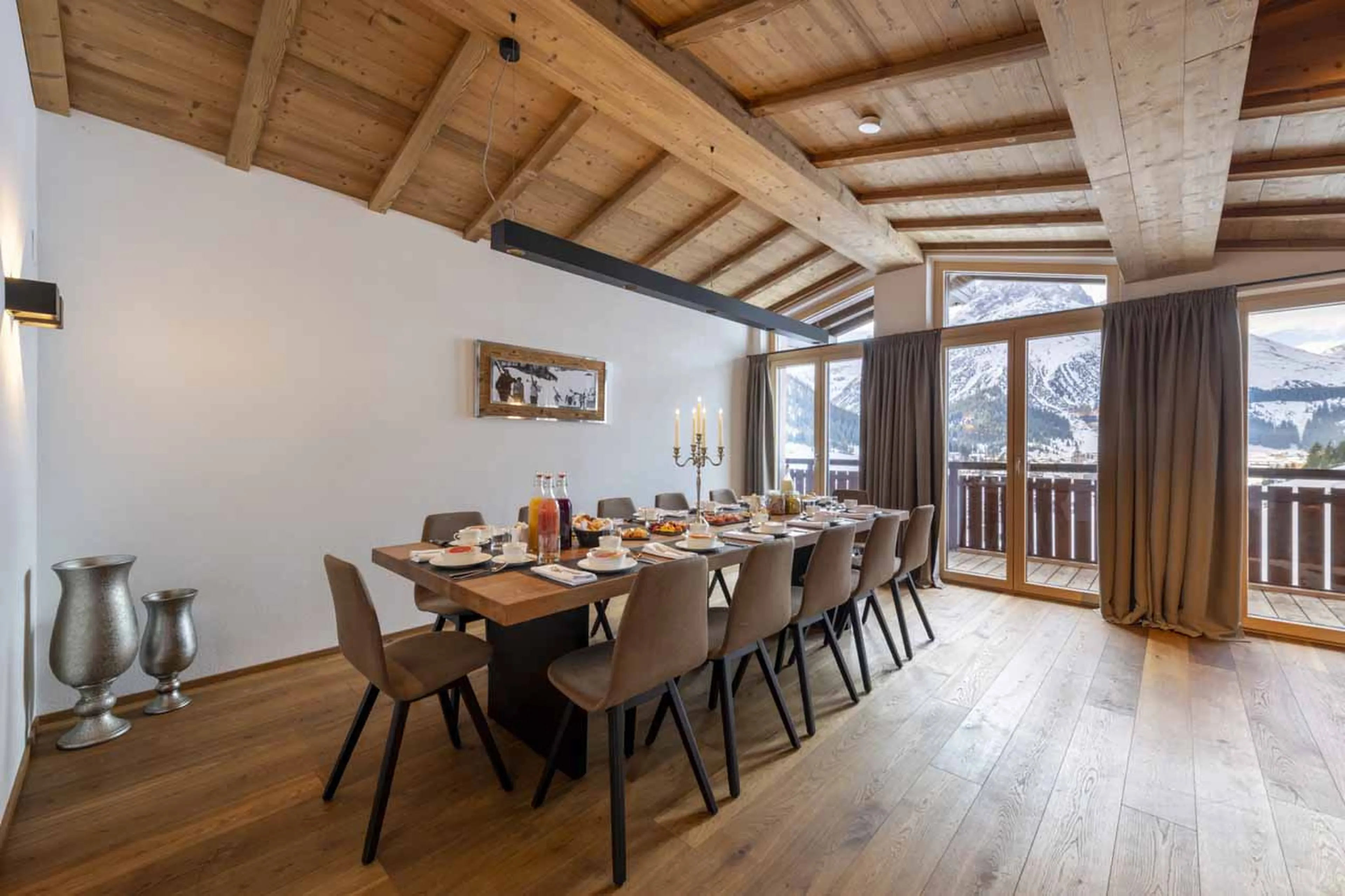 Dining table with balcony access at Buhlhof Penthouse in Lech