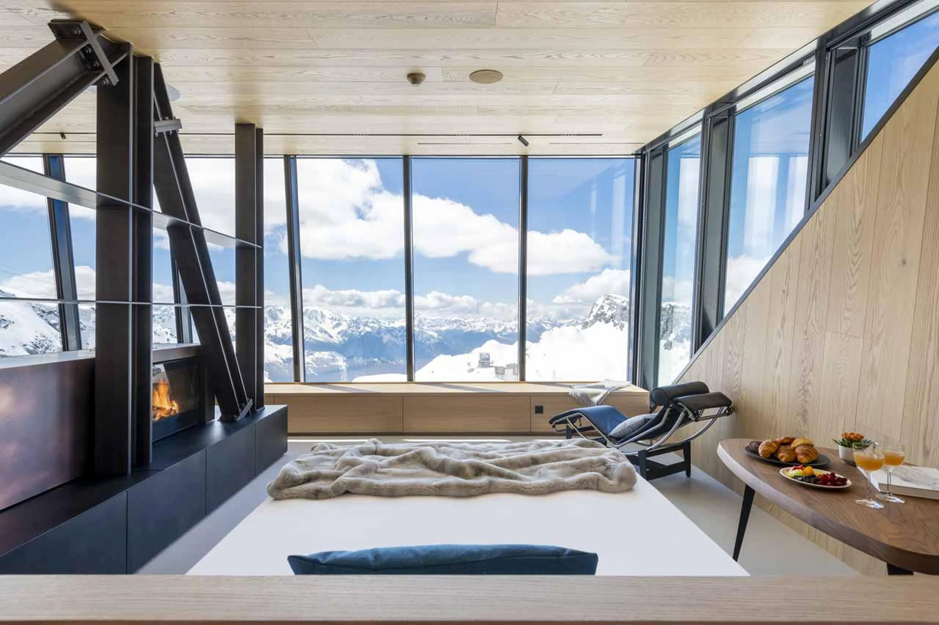 Mountain views through floor-to-ceiling windows in Cabane Tortin, Verbier