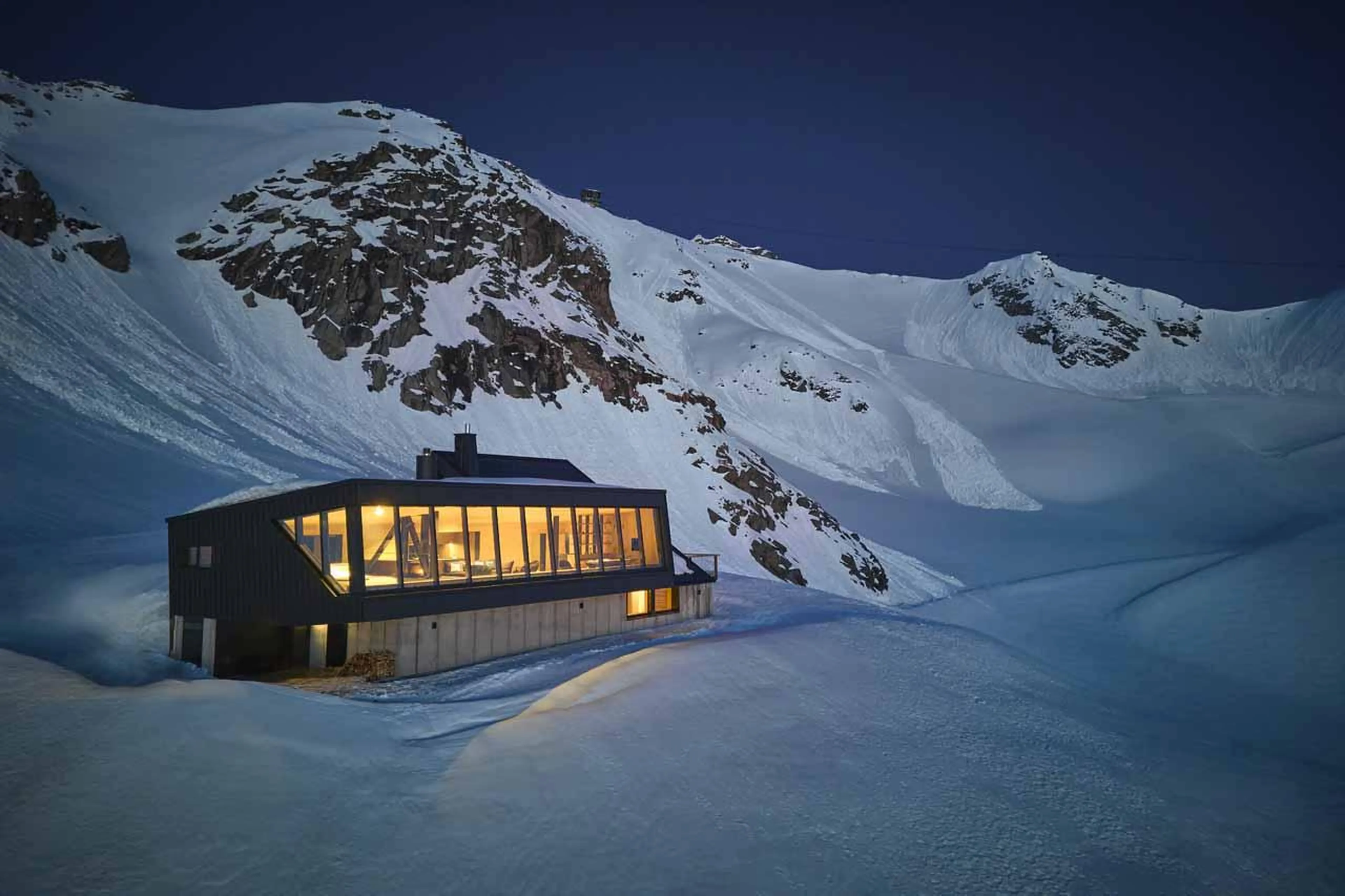 Cabane Tortin, Verbier with lights on at night