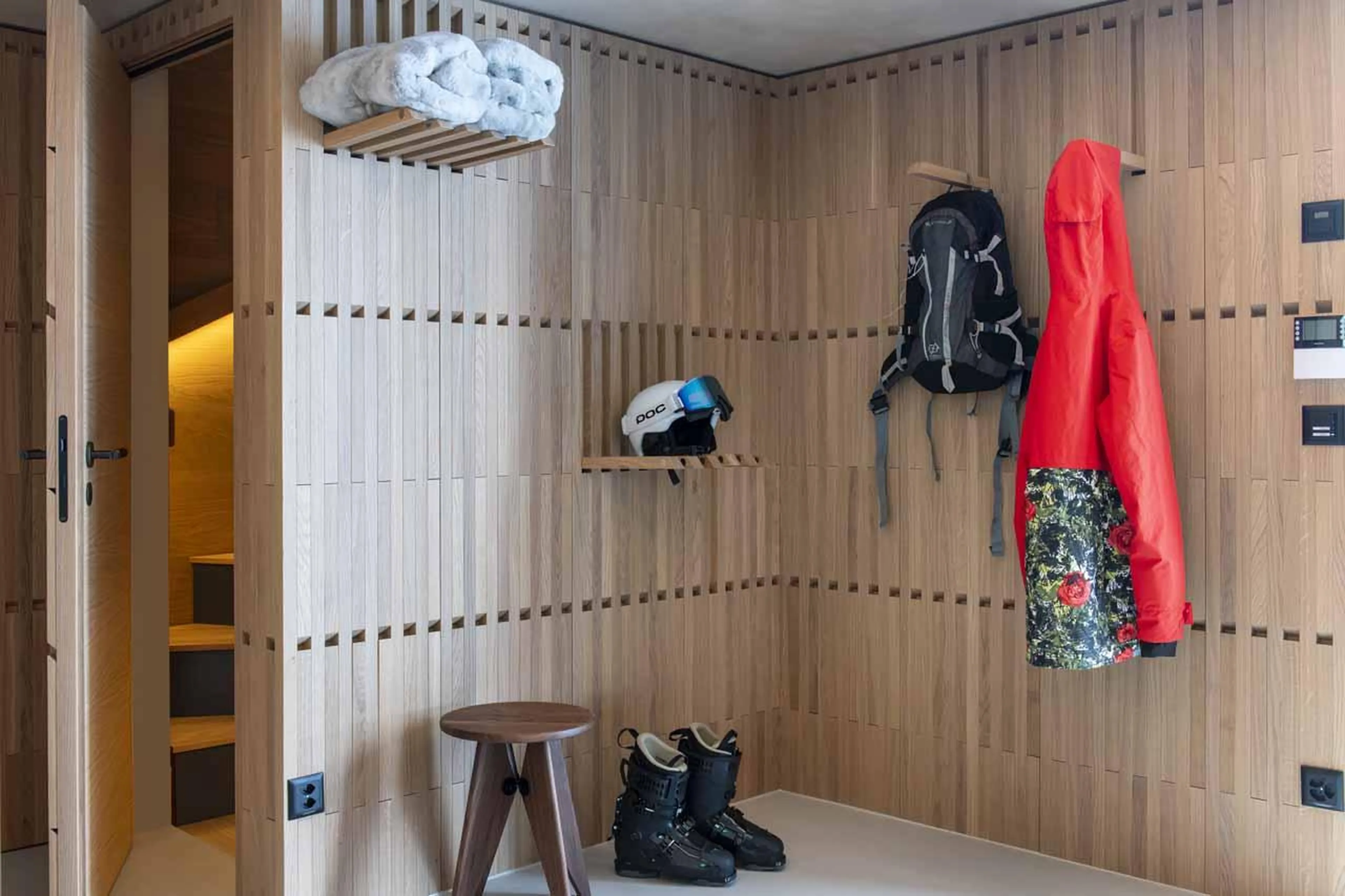 Wooden peg board hanging items in Cabane Tortin, Verbier