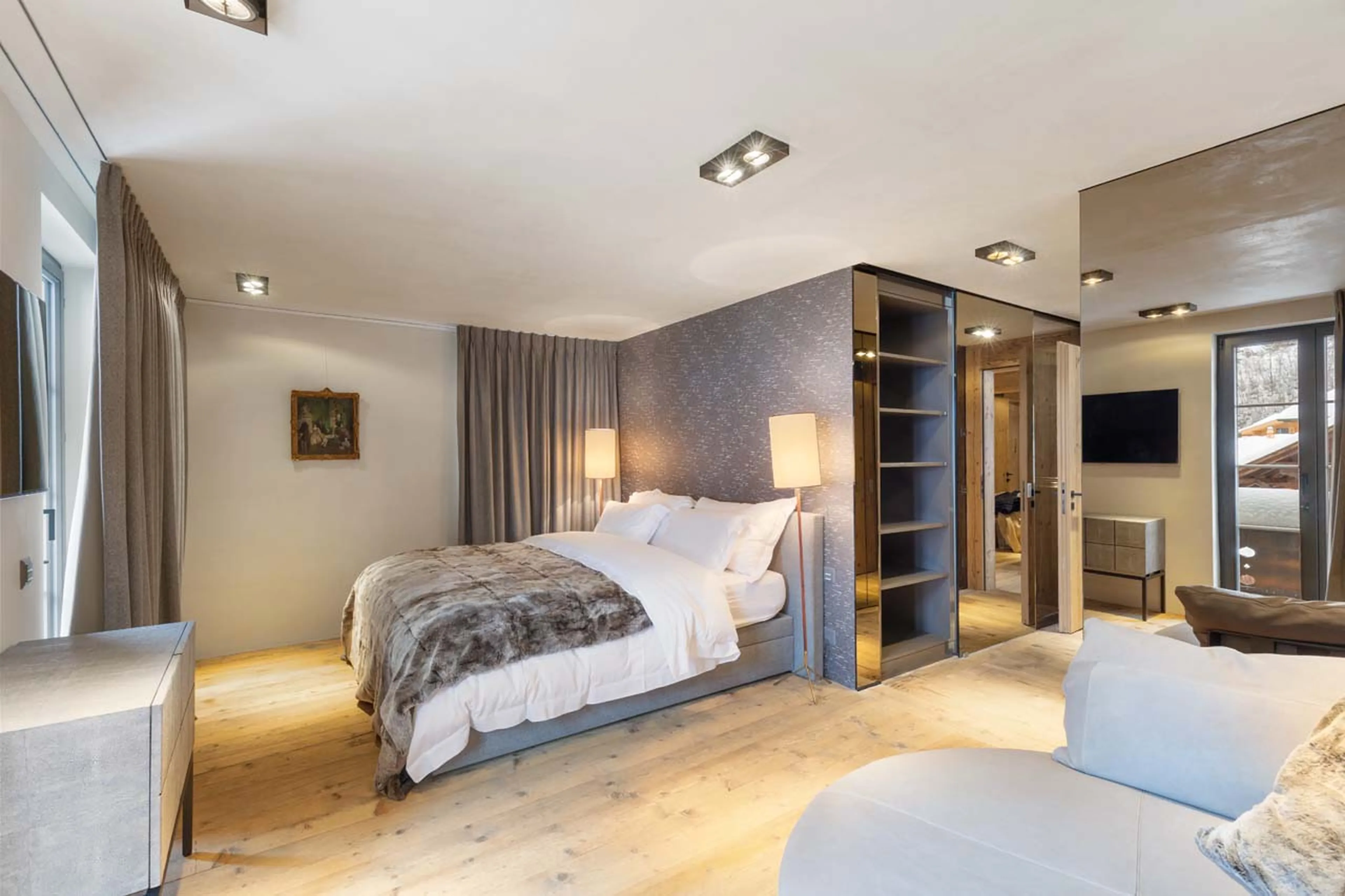 Bedroom one lounge area at Casa Promenade in Gstaad