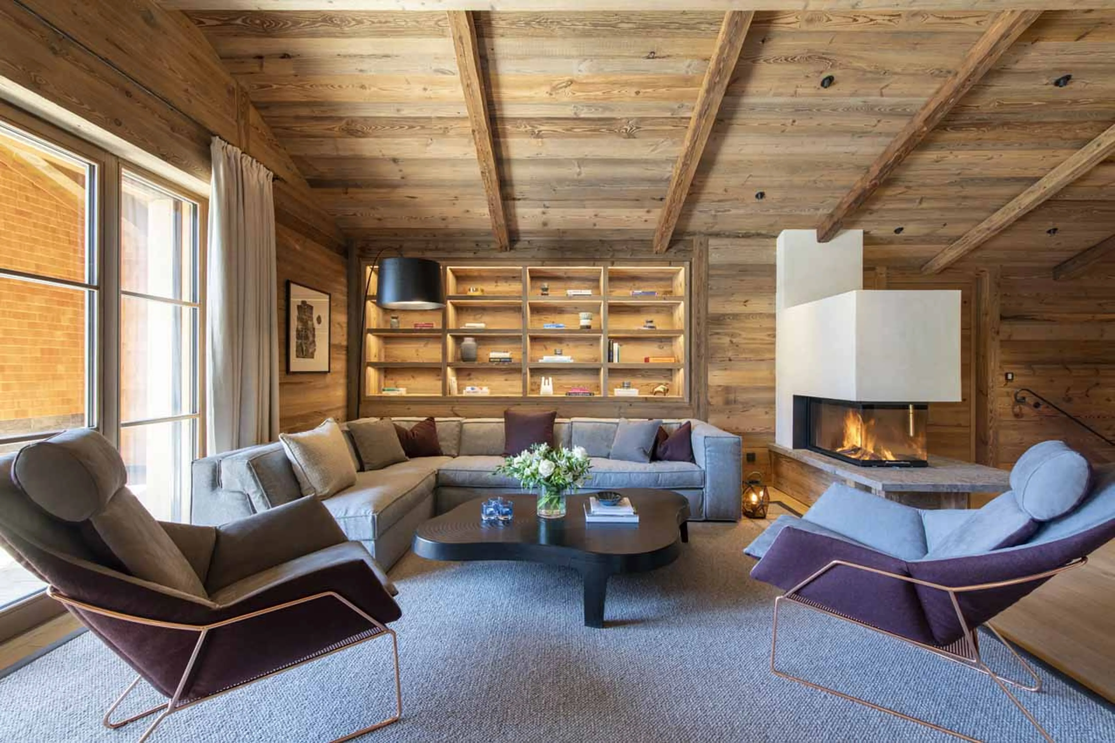 Living area with fireplace at Chalech L in Lech