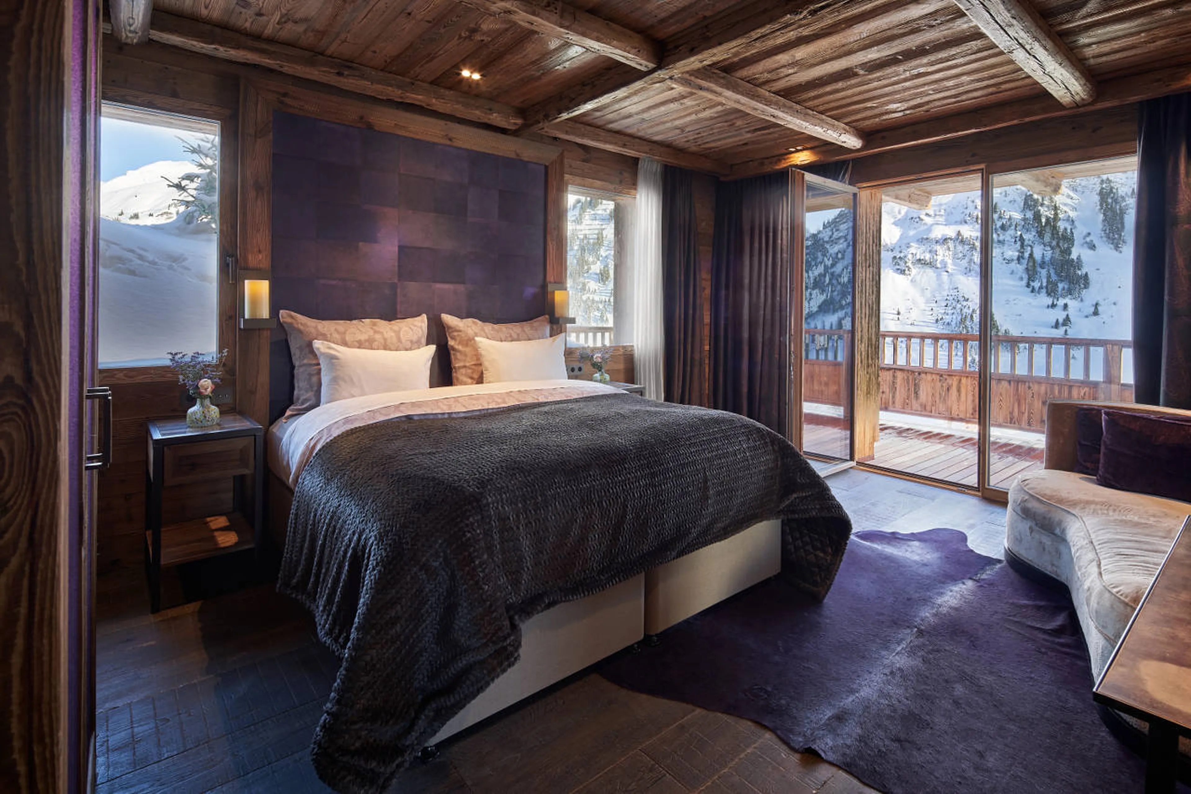 Double bedroom with en-suite shower room and balcony access in Chalet 1551 in Lech