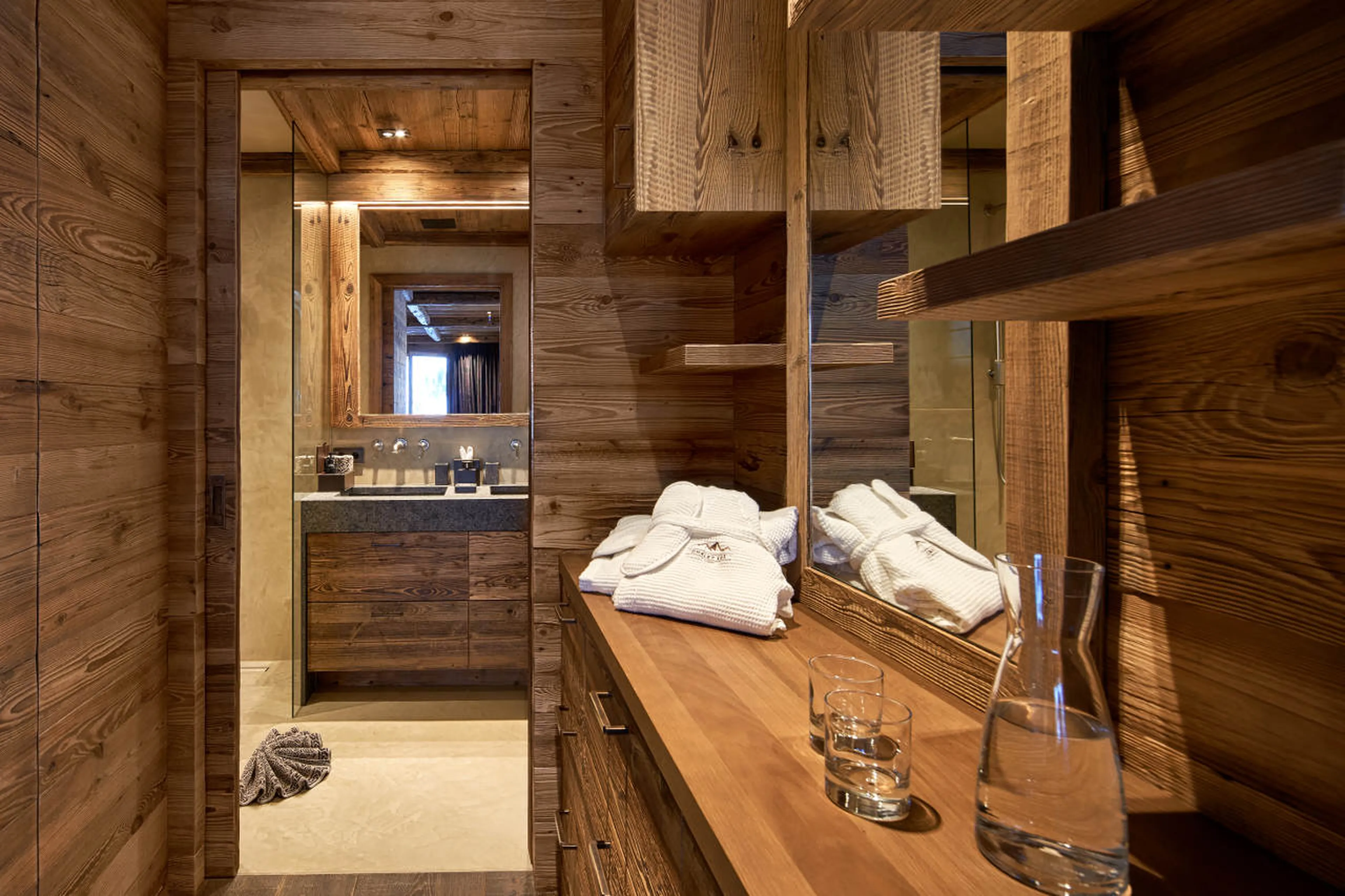 Dressing area in double bedroom with balcony access in Chalet 1551 in Lech