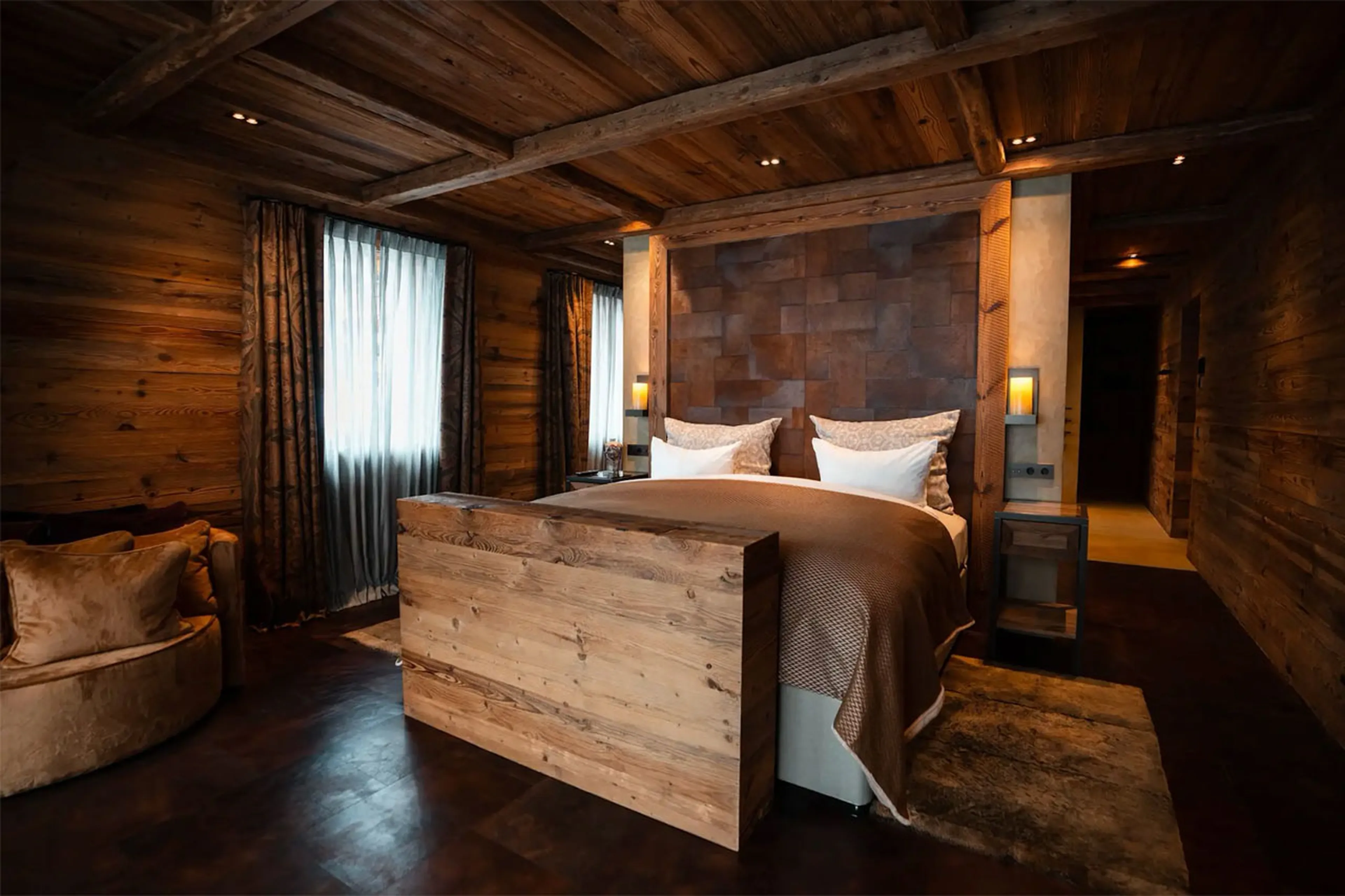 Master bedroom with dressing room and balcony access in Chalet 1551 in Lech