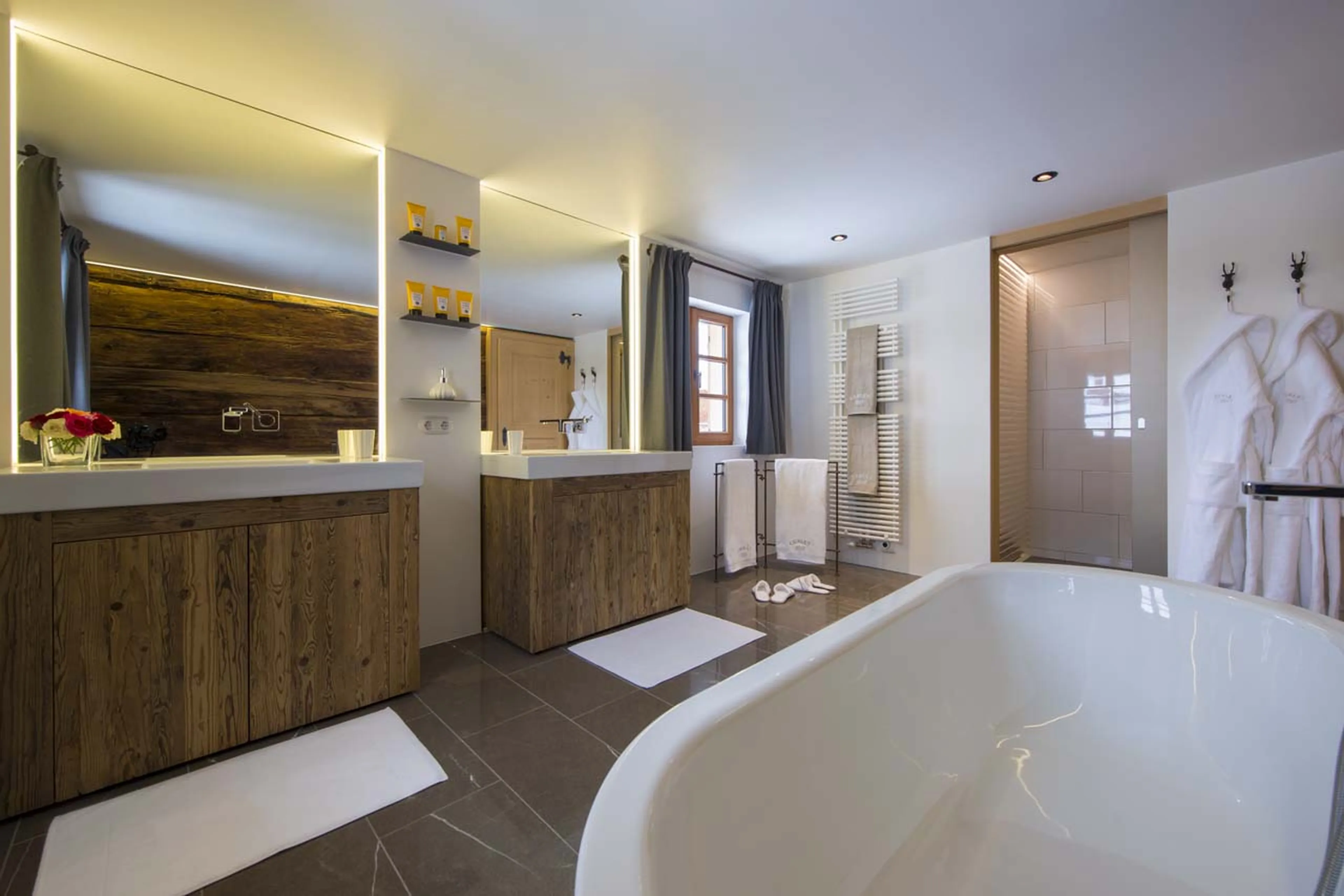 Large bathroom with double basin, en suite to master bedroom in Chalet 1597 in Lech