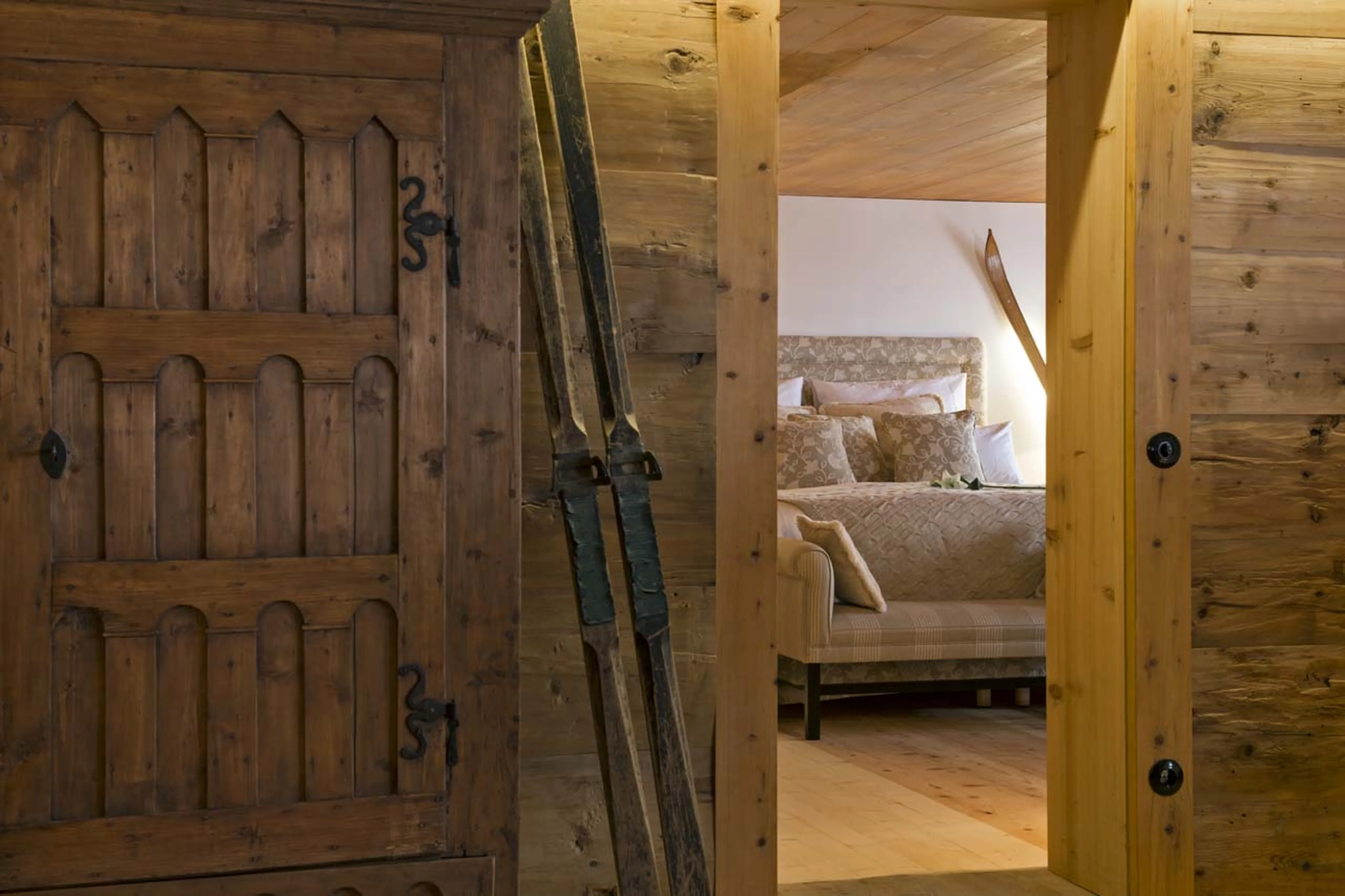 Mountain skis adorn the centuries old ski Chalet 1597 in Lech