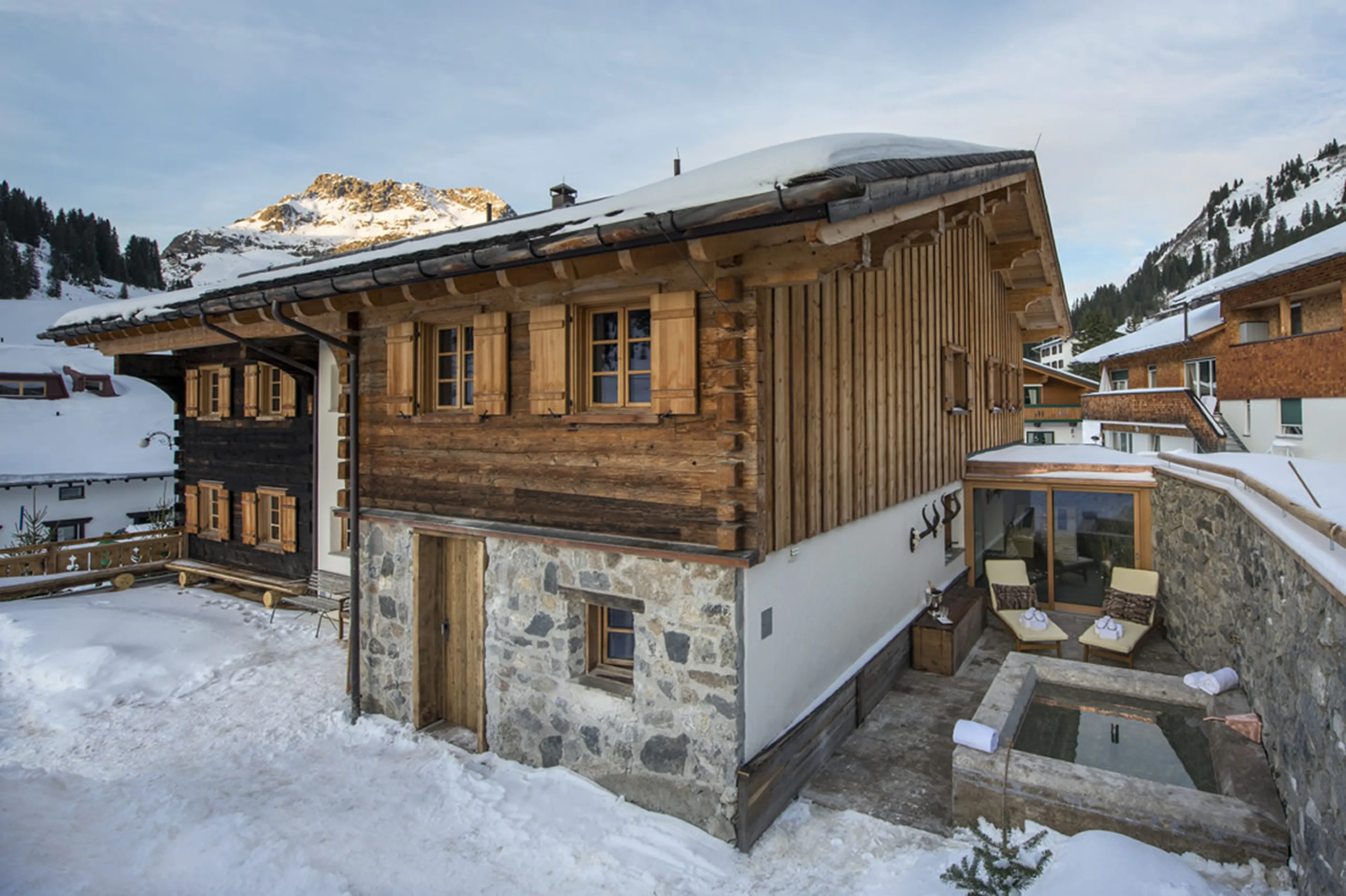 Old wood and sturdy stonework lasting for centuries in Chalet 1597 in Lech