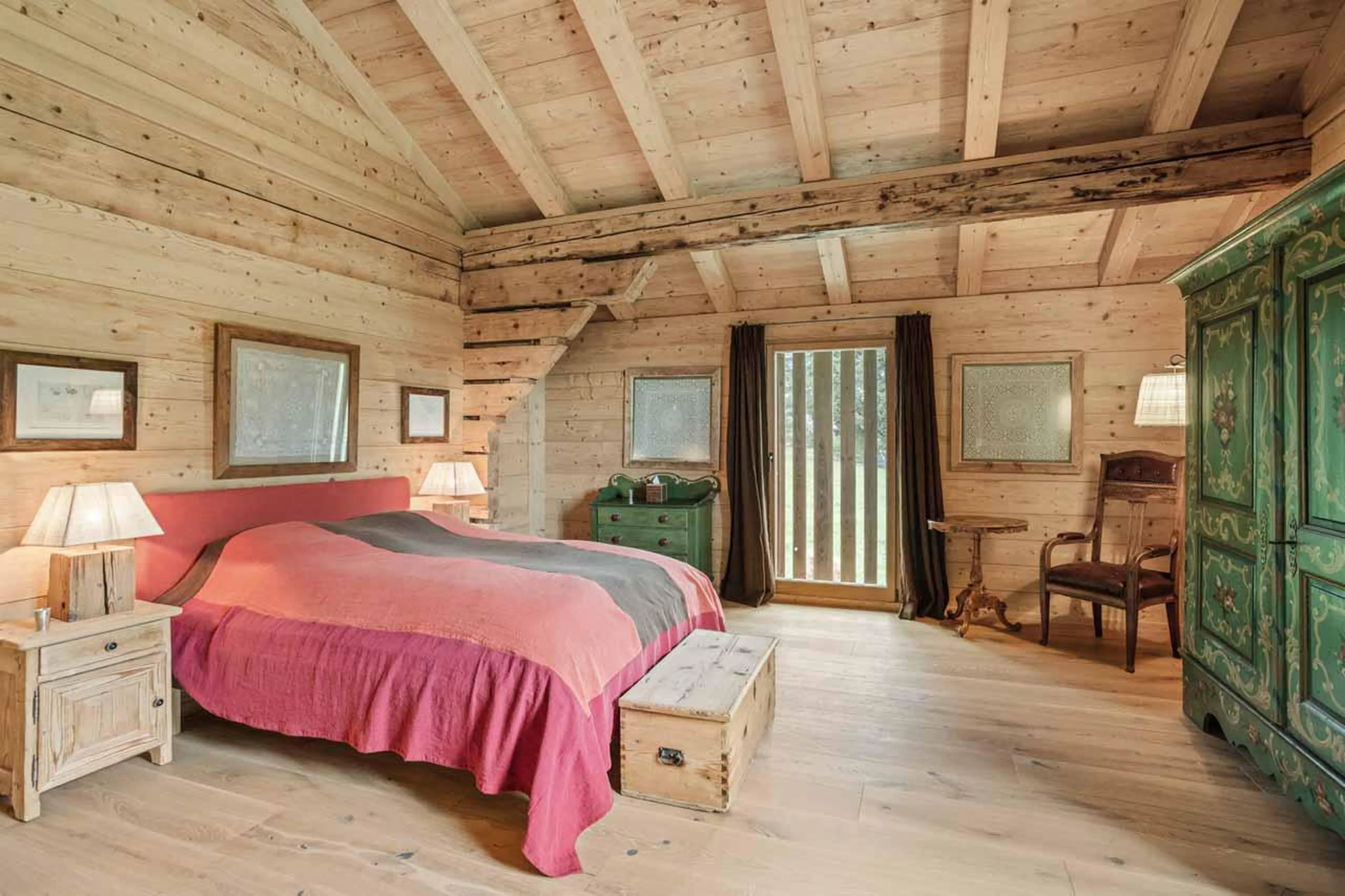 Spacious double bedroom with garden access in Chalet 1808, Gstaad