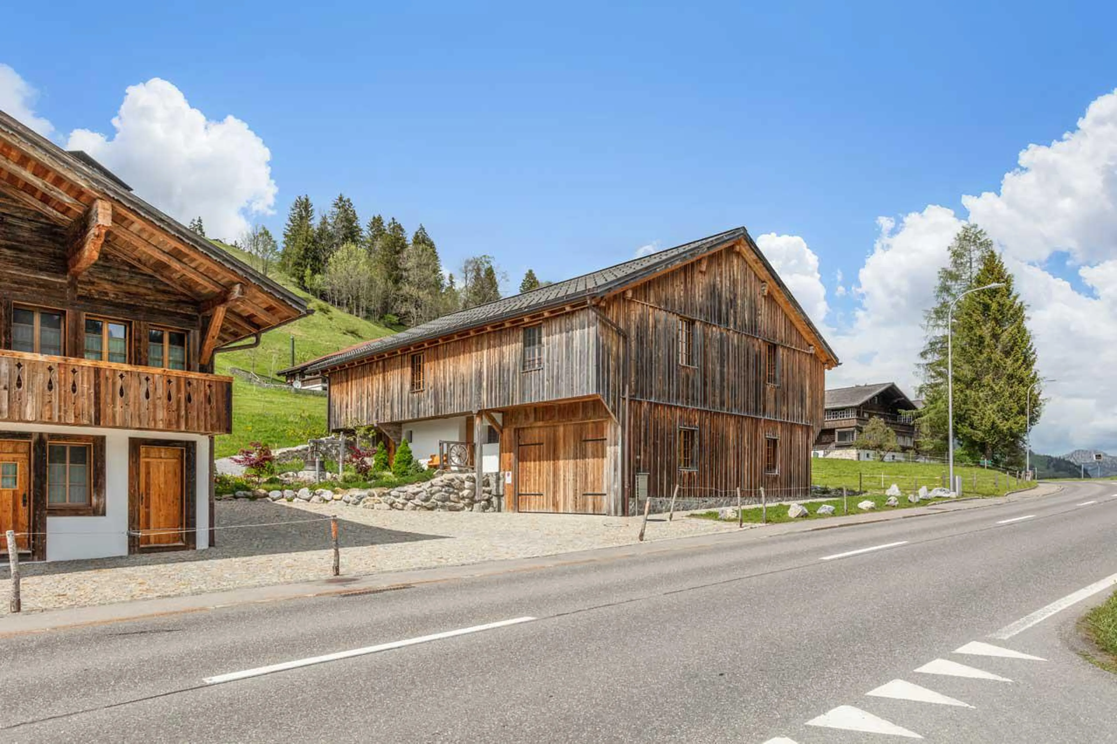 Exterior of chalet and barn at Chalet 1808, Gstaad