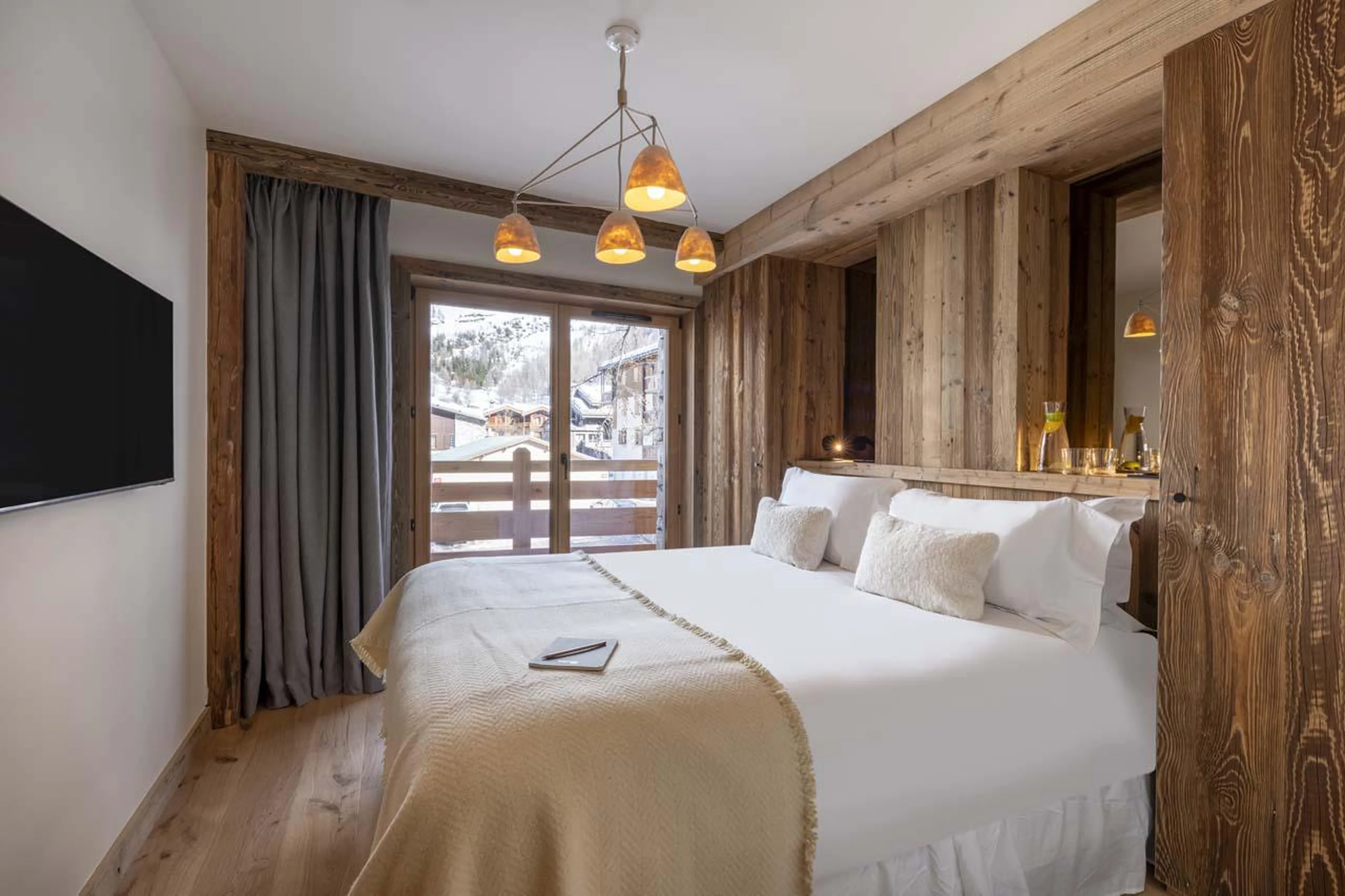 Double bedroom with private balcony at Chalet 1850 in Val d'Isere