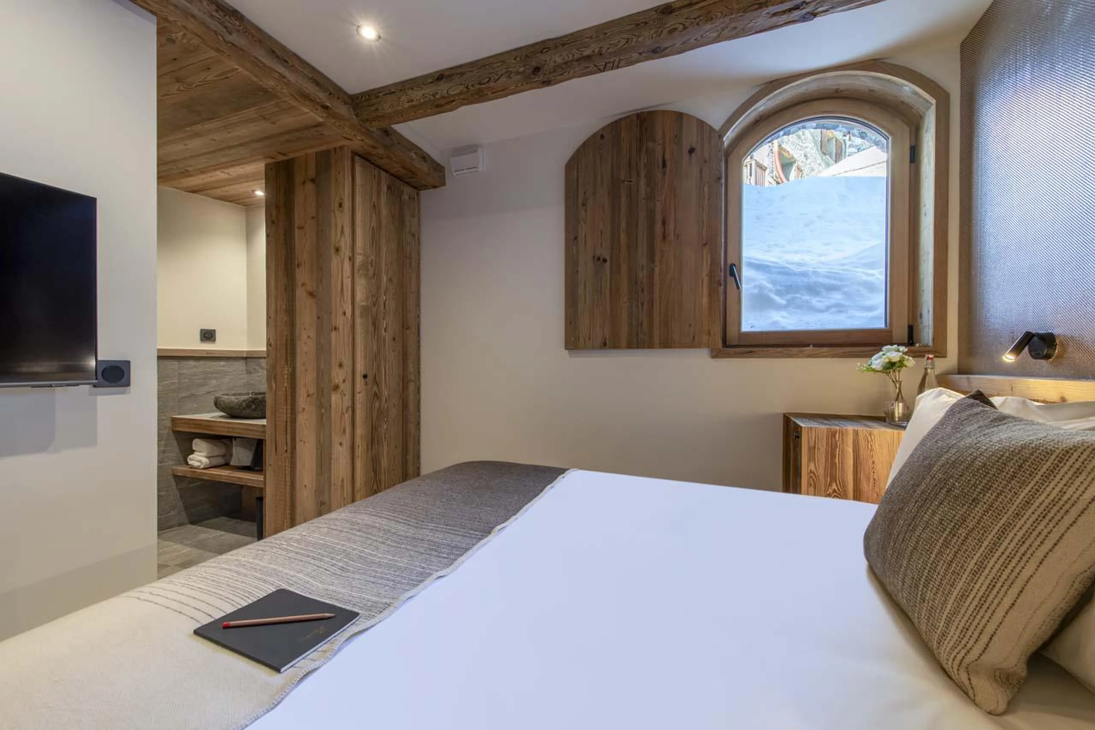 Double bedroom with snowy views at Chalet 1855 in Val d'Isere
