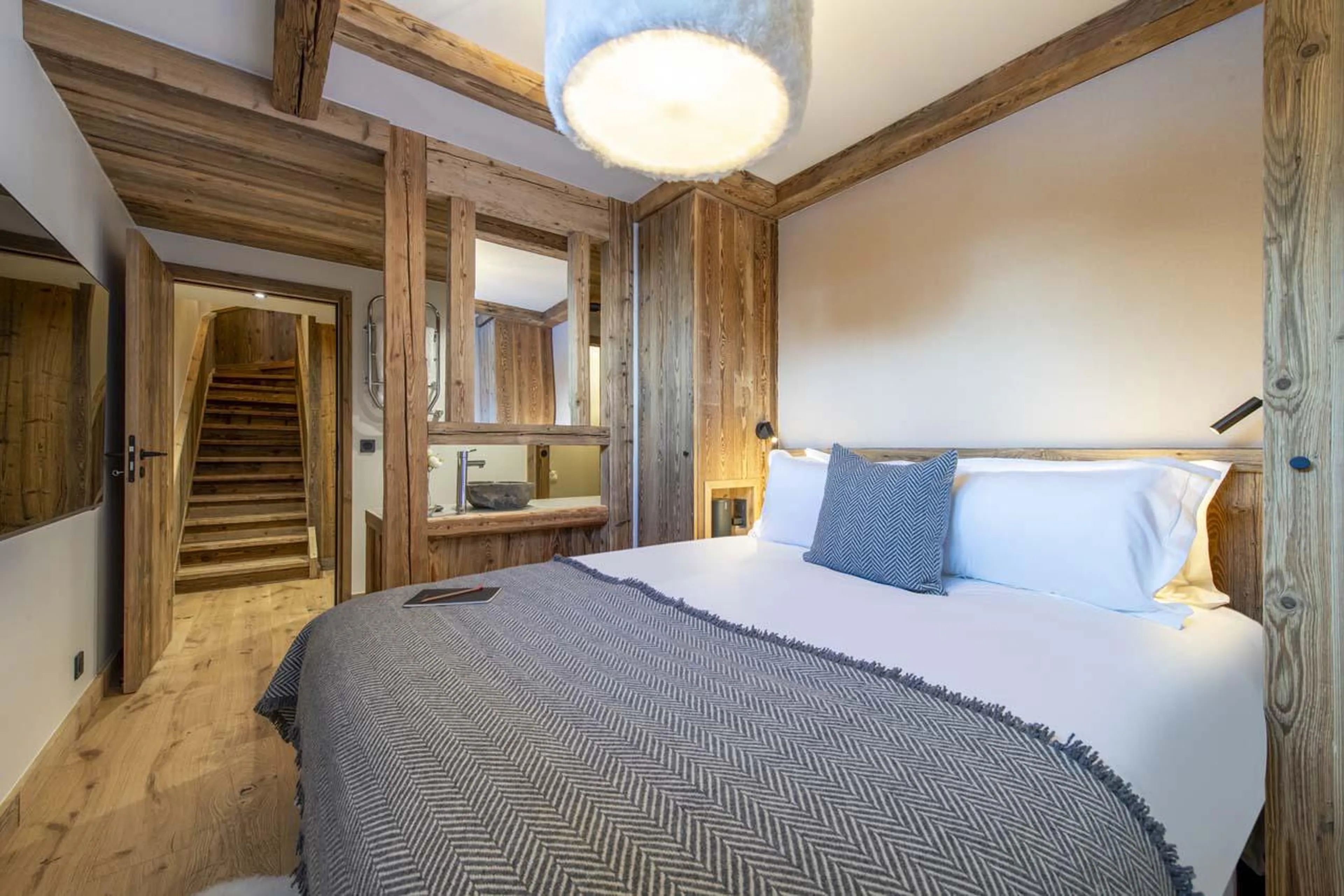 Double bedroom with TV and en-suite shower room at Chalet 1855 in Val d'Isere