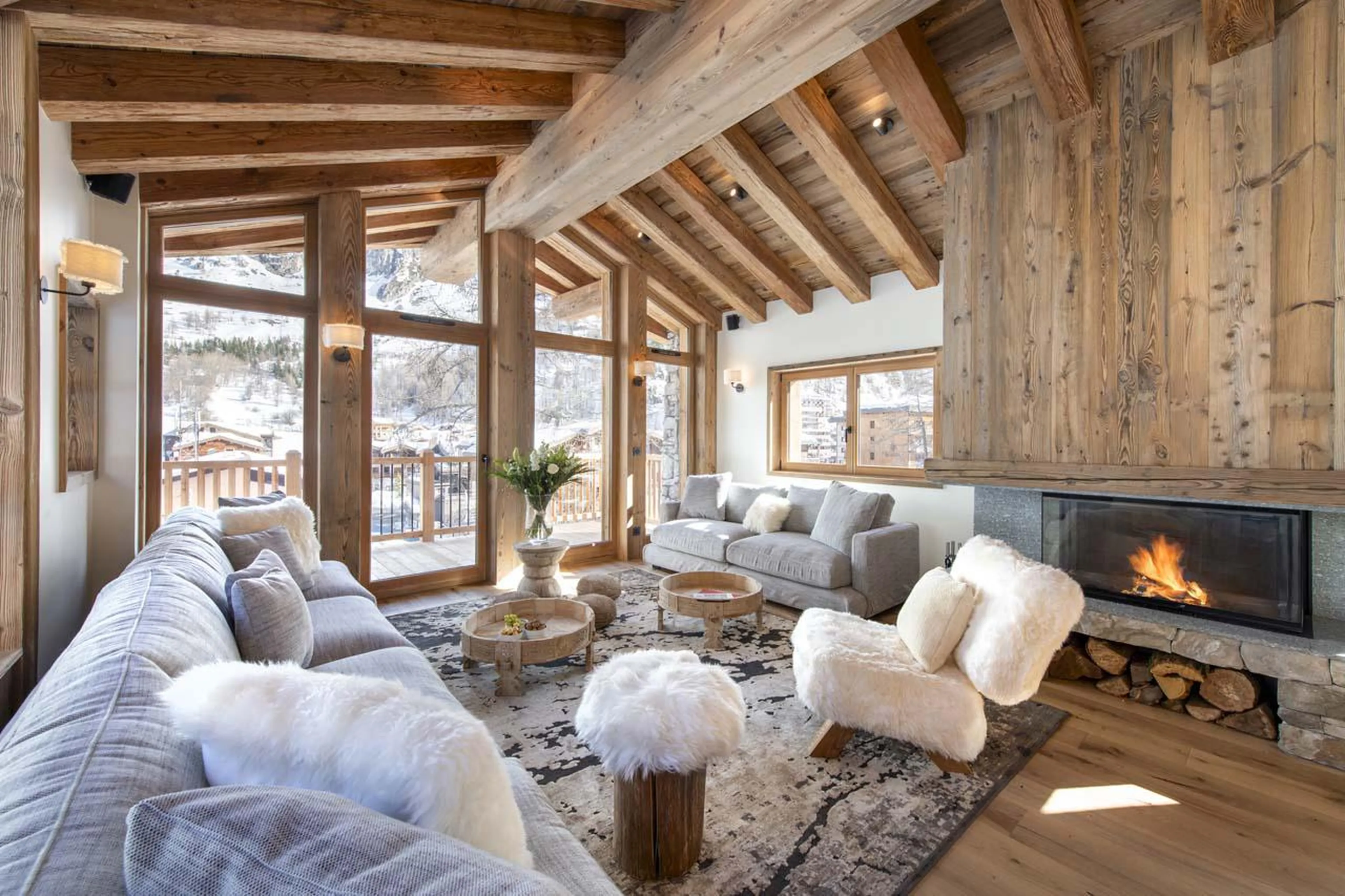 Open-plan living area flooded with natural light at Chalet 1855 in Val d'Isere
