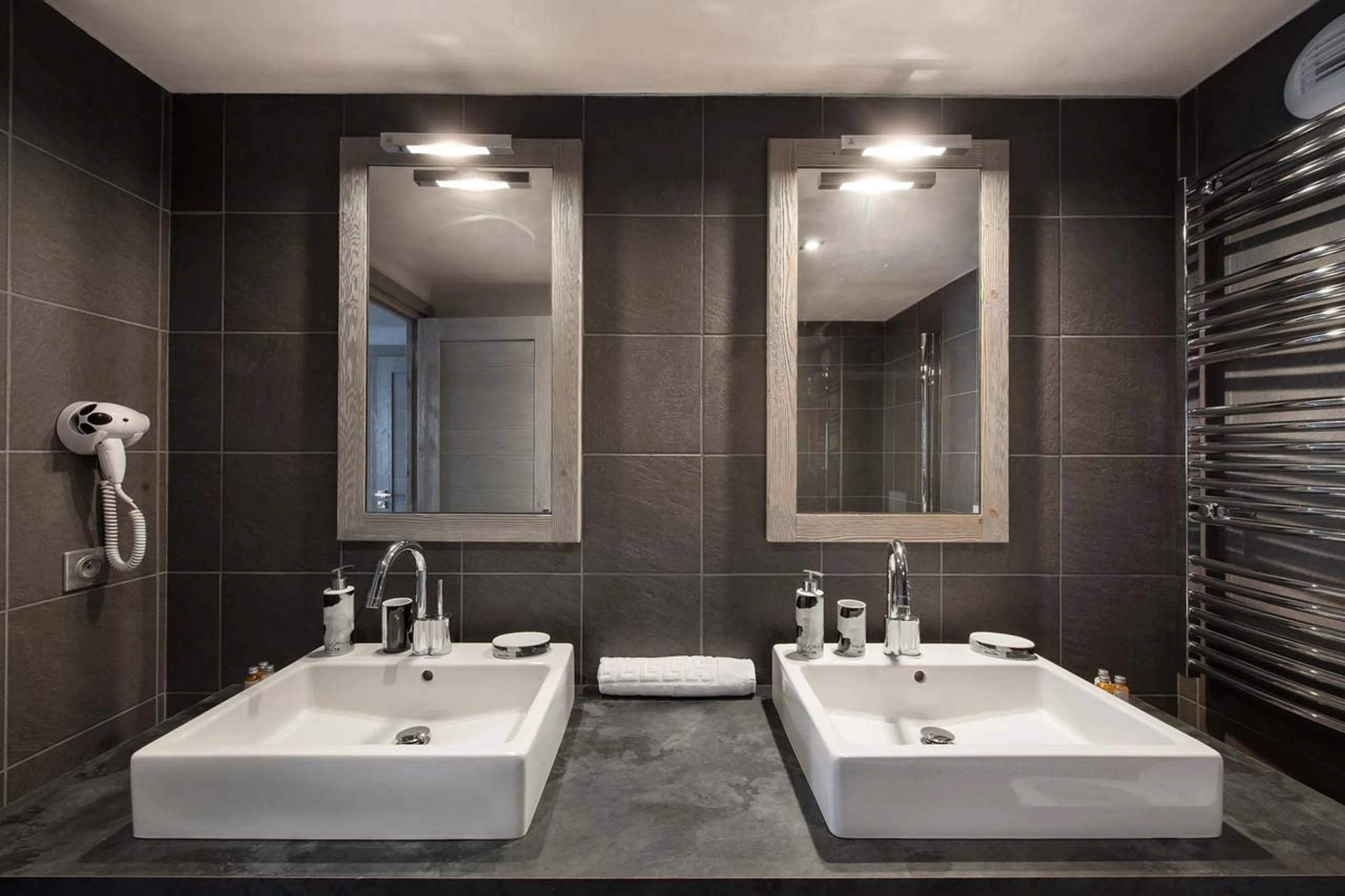 Twin basins in bathroom one at Apartment Abondance in Courchevel 1650