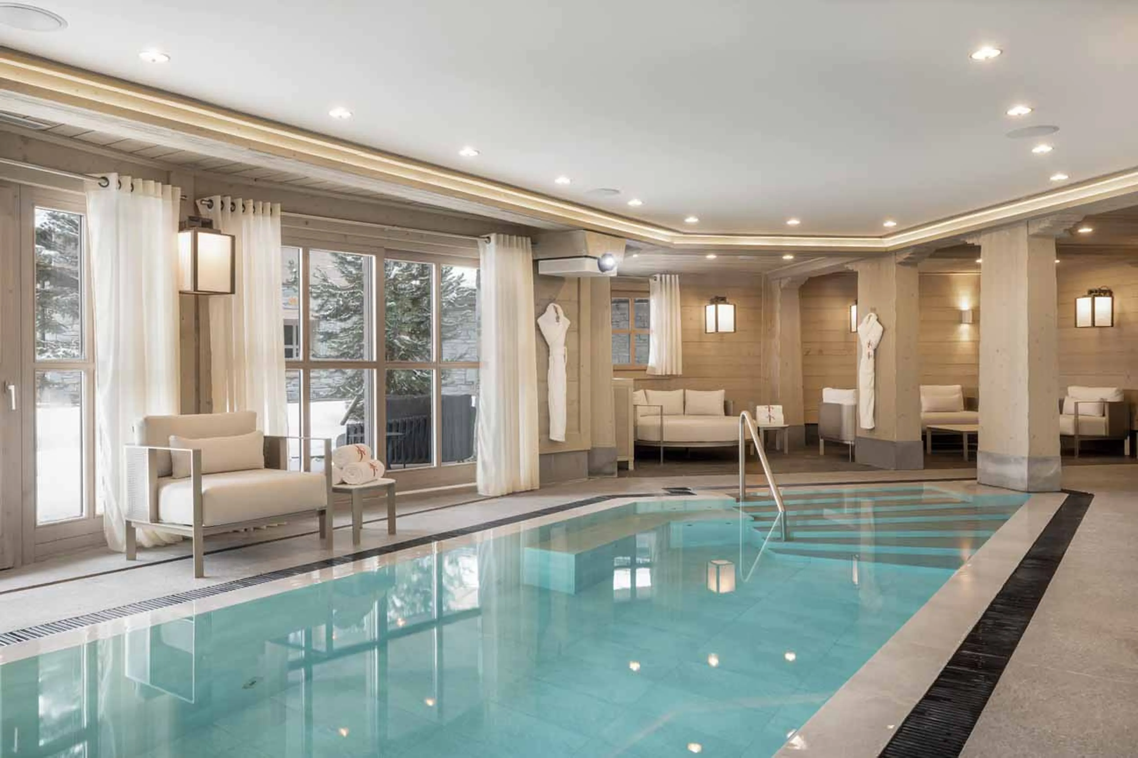 Pool with waterfall features and terrace access in Chalet Abruzzes in Courchevel 1850