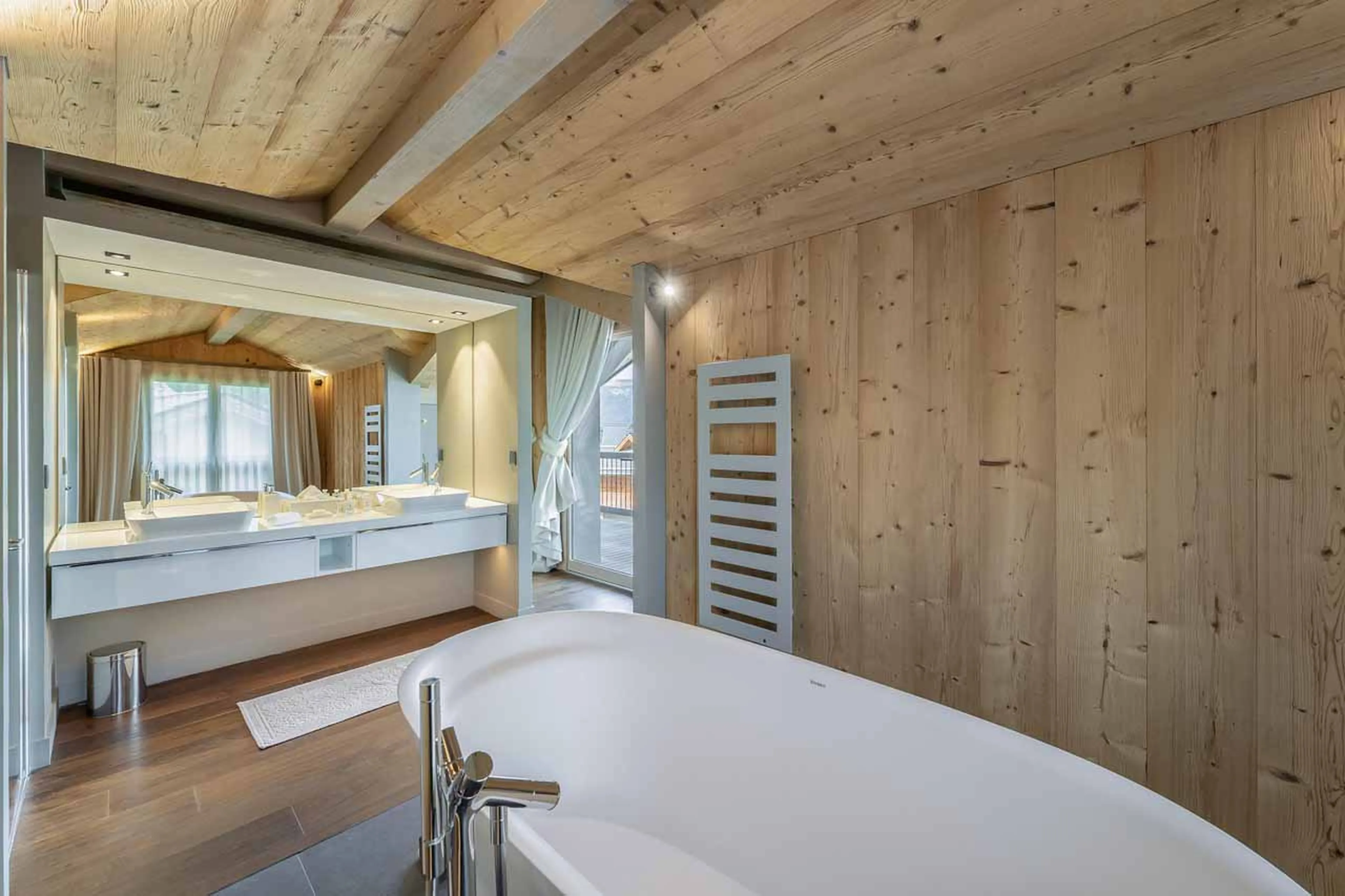 En-suite bathroom with mountain views at Chalet Acelia in Courchevel 1550