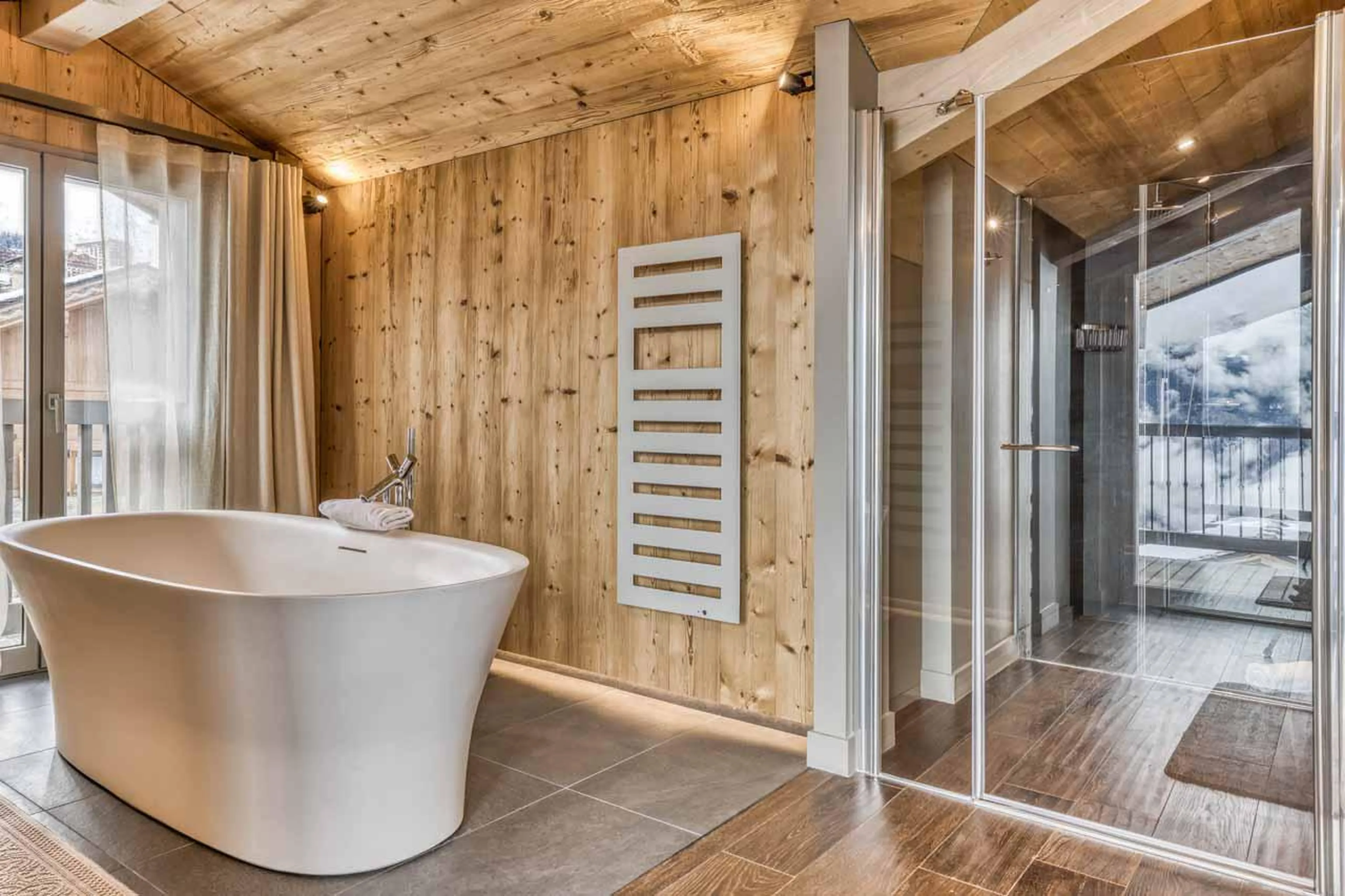 En-suite bathroom with mountain views at Chalet Acelia in Courchevel 1550