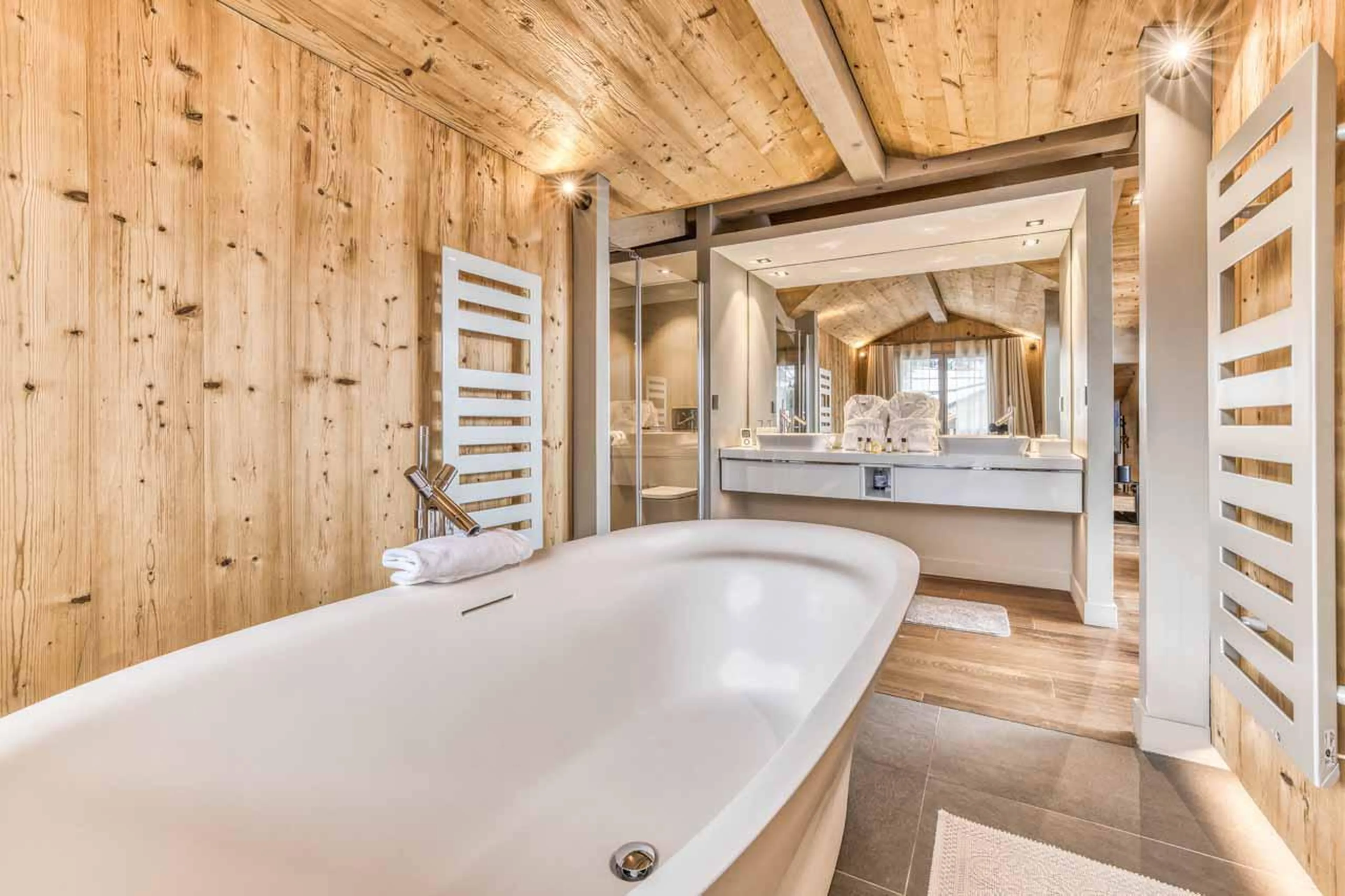 En-suite bathroom with  bath and double basin at Chalet Acelia in Courchevel 1550