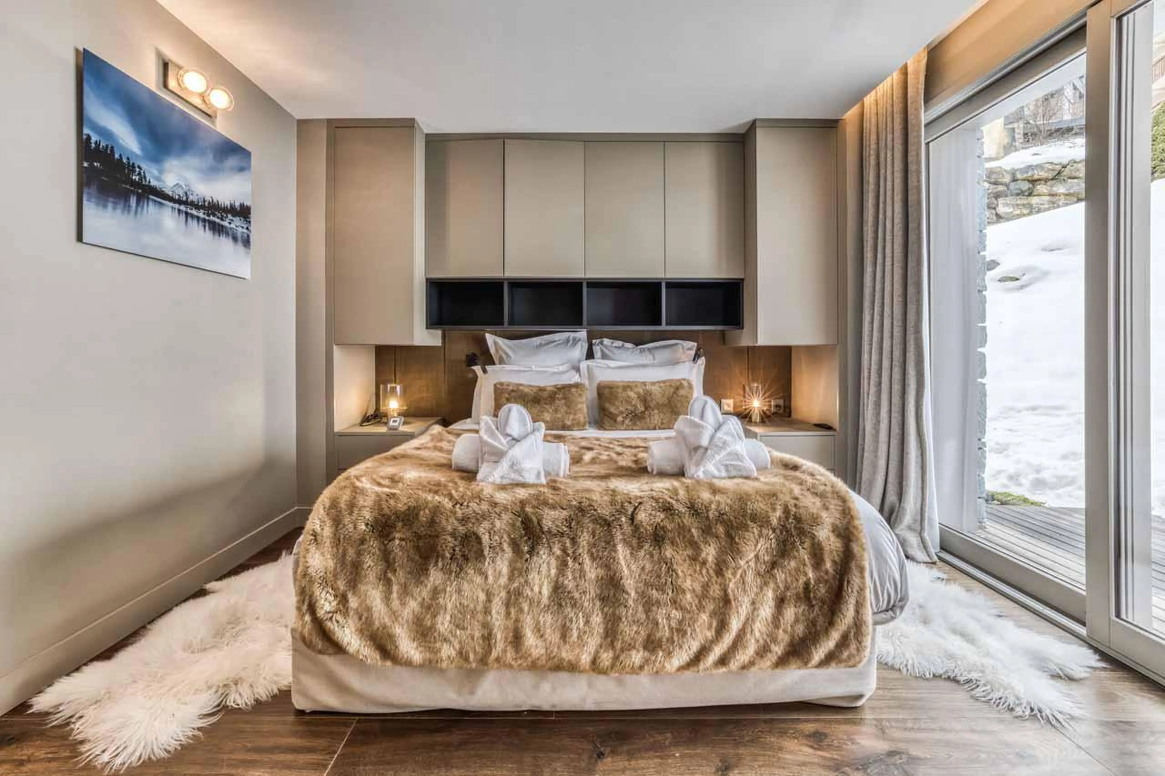 Double bedroom with plentiful storage space at Chalet Acelia in Courchevel 1550