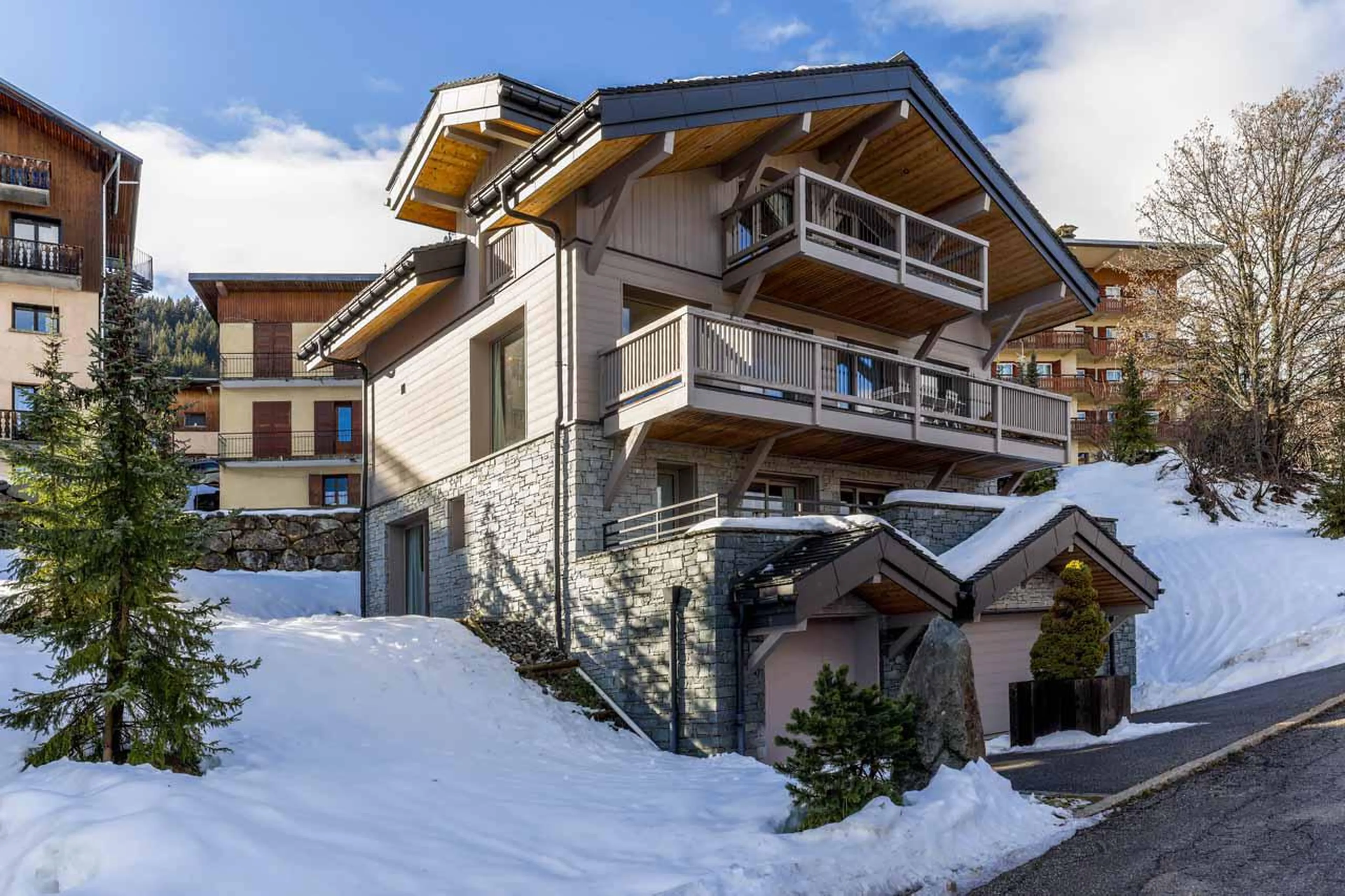 Snowy chalet exterior at Chalet Acelia in Courchevel 1550