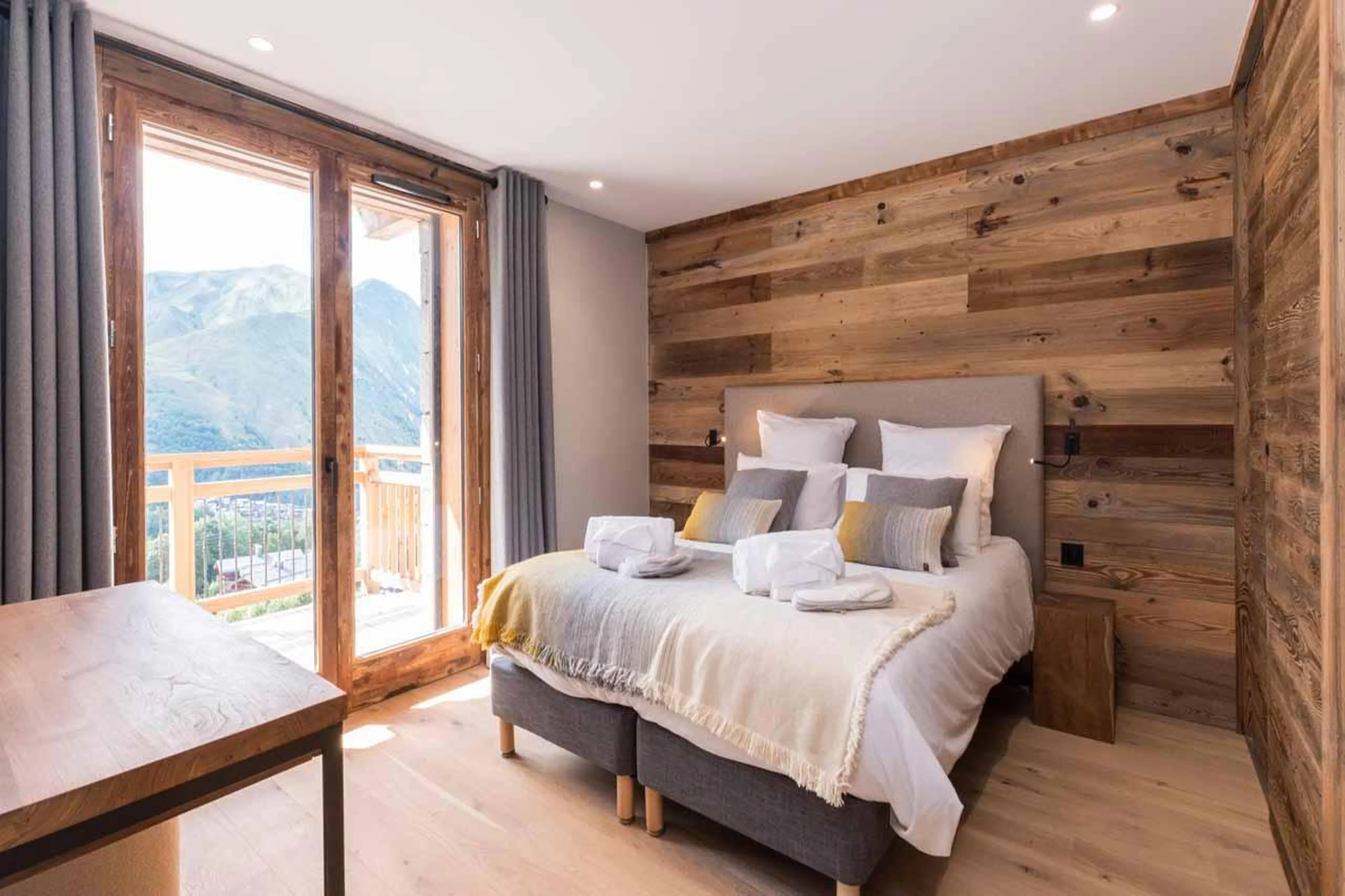 Double bedroom with French doors in Chalet Acolou, Saint Martin de Belleville