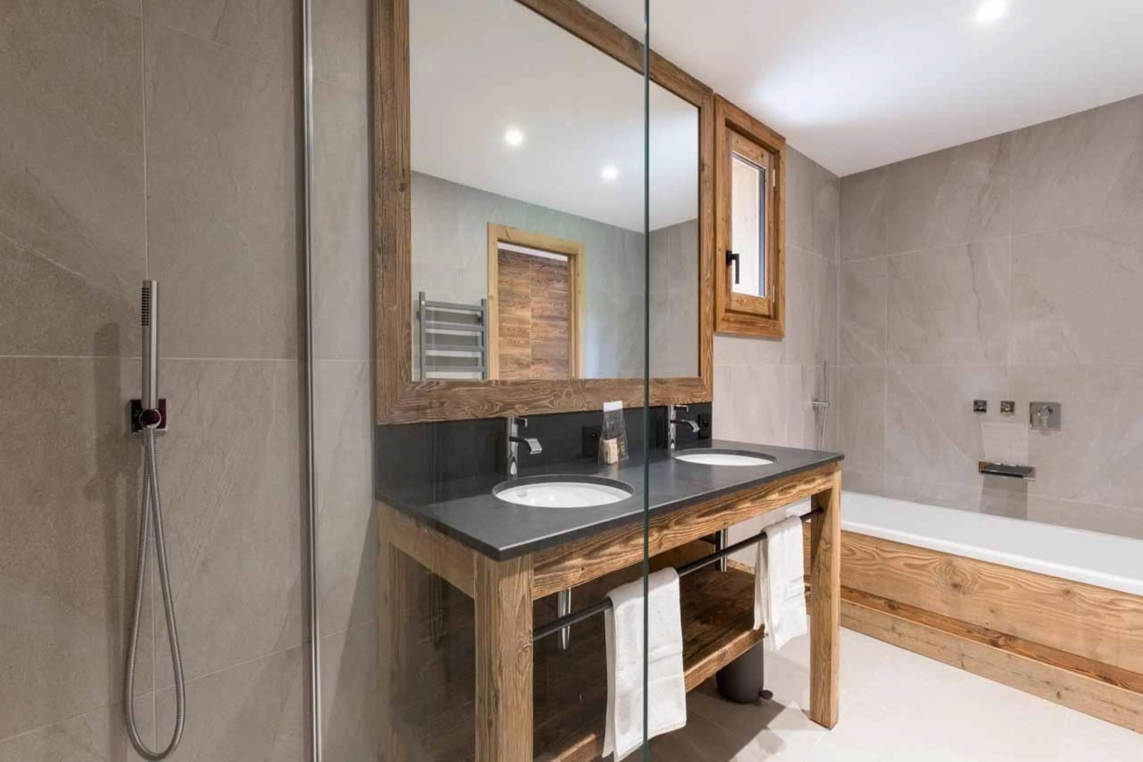 Bathroom with double basin and separate shower in Chalet Acolou, Saint Martin de Belleville