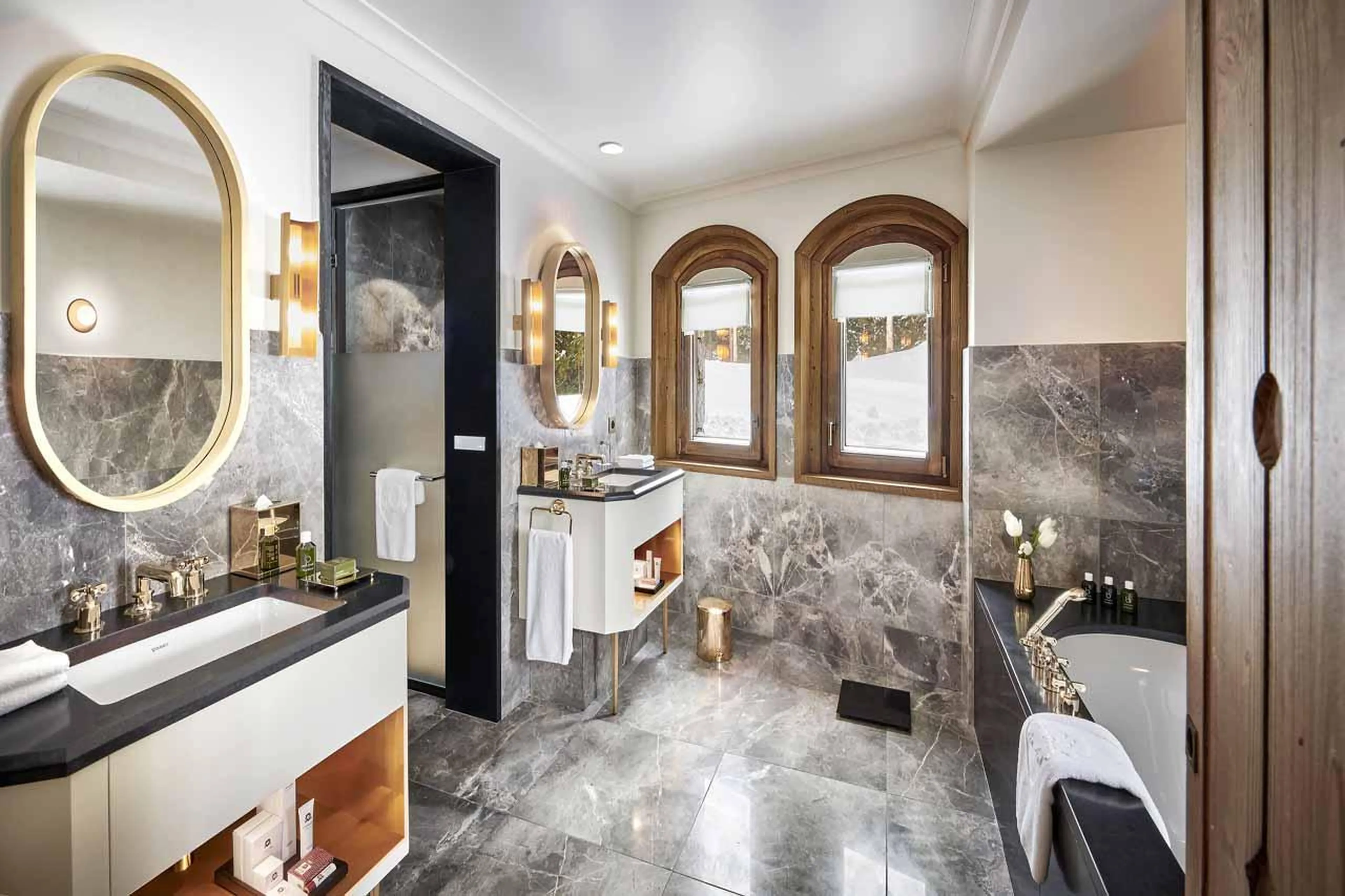 En suite bathroom with bath, hammam shower and double basin in Chalet Alpensia in Courchevel 1850