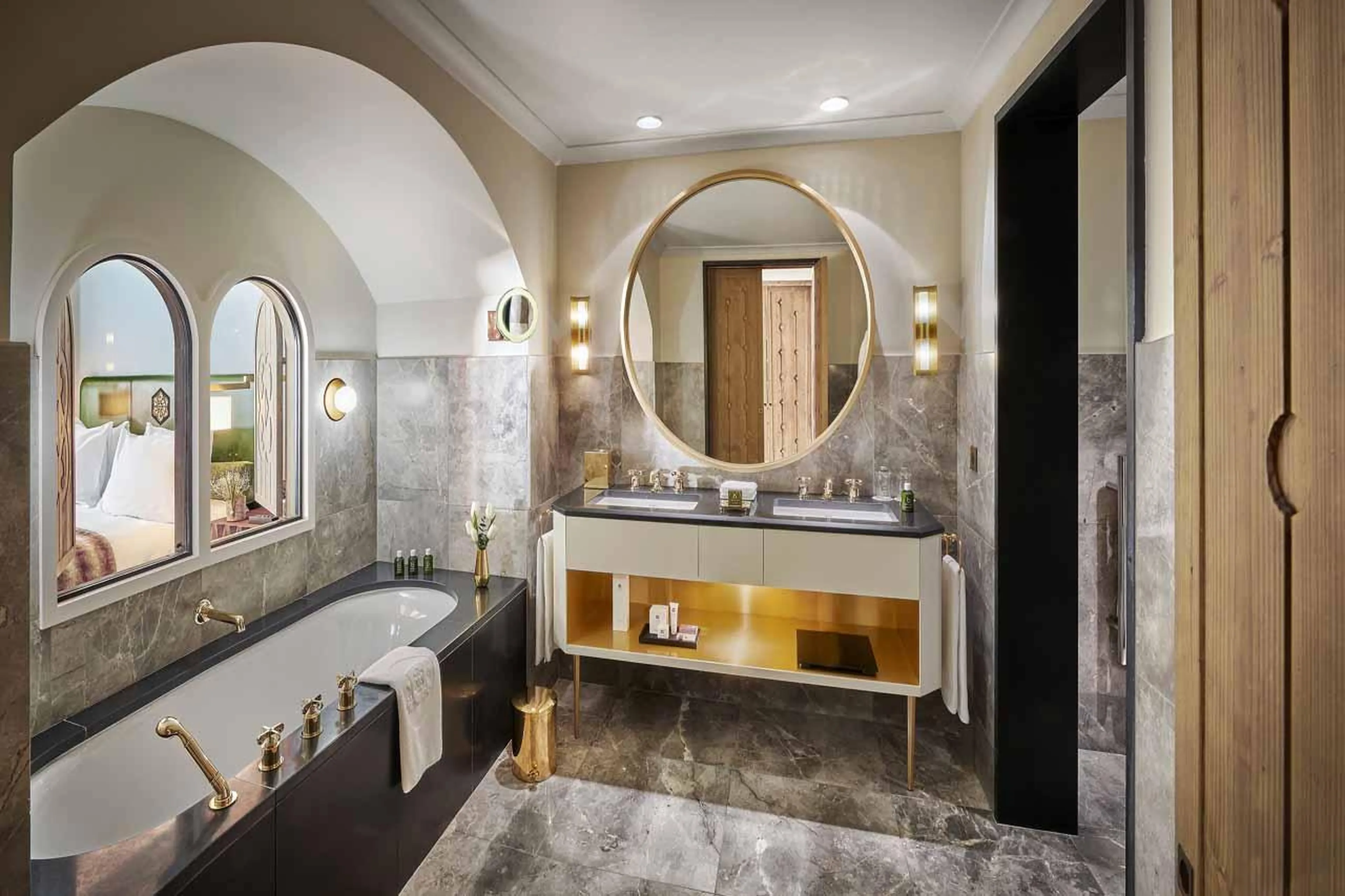 En suite bathroom with bath and double basin in Chalet Alpensia in Courchevel 1850
