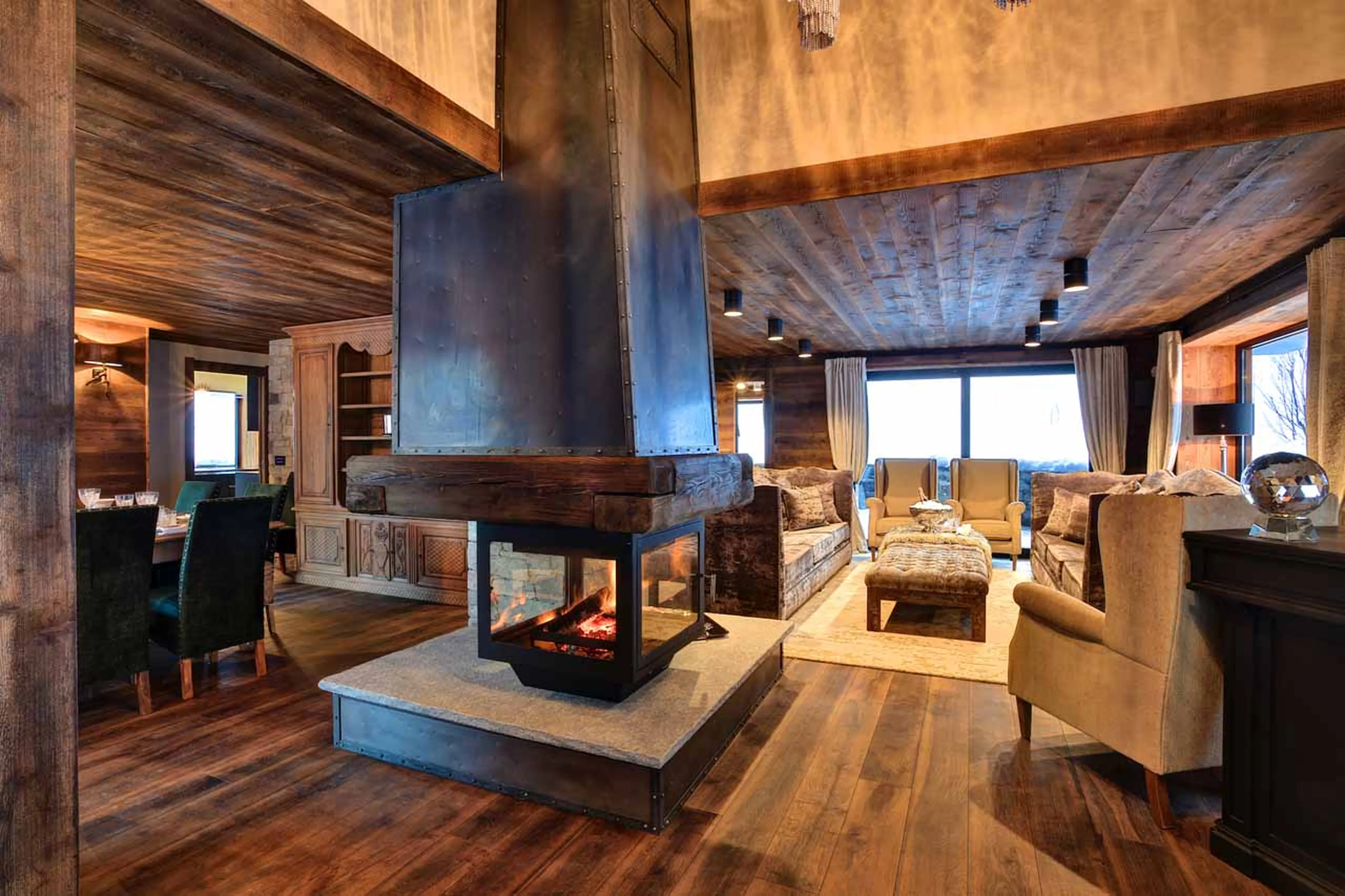 Cosy living area with fireplace at Chalet Alta in Chamonix