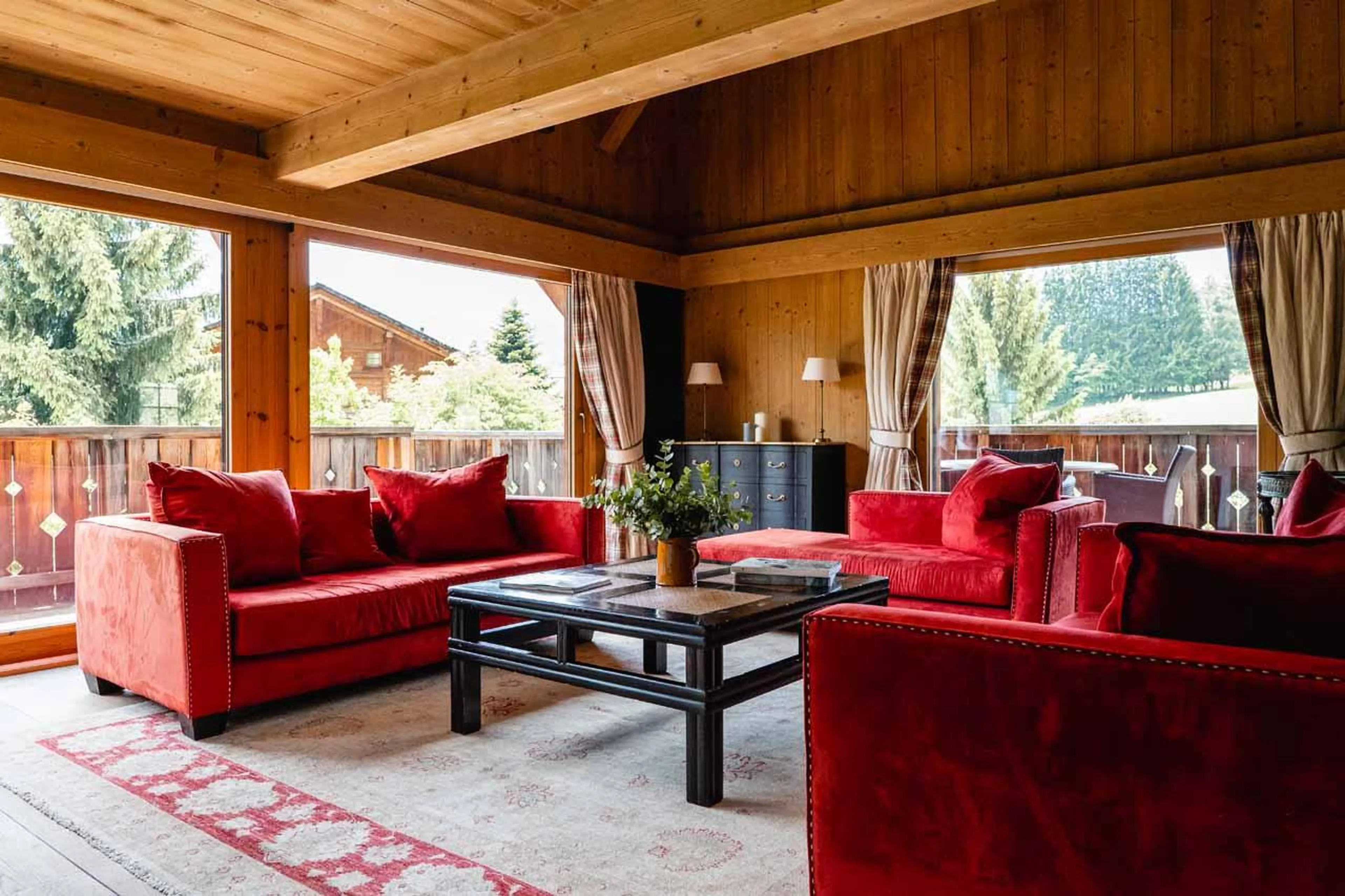 Sofas, coffee table and fireplace in Chalet Ambroise, Megeve