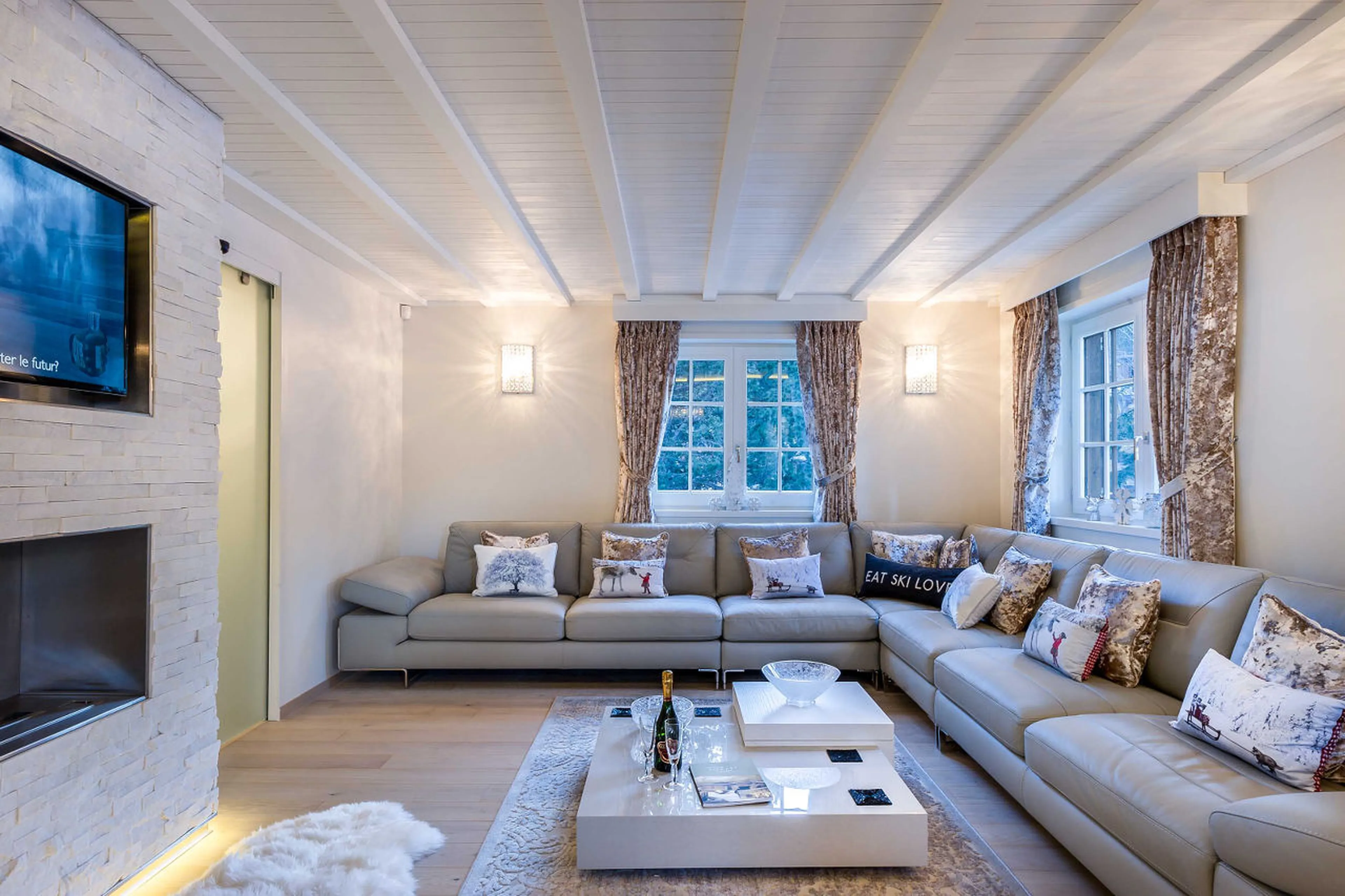 Large living room with ethanol fireplace and Sky TV in Chalet Amnesia in Courchevel 1650