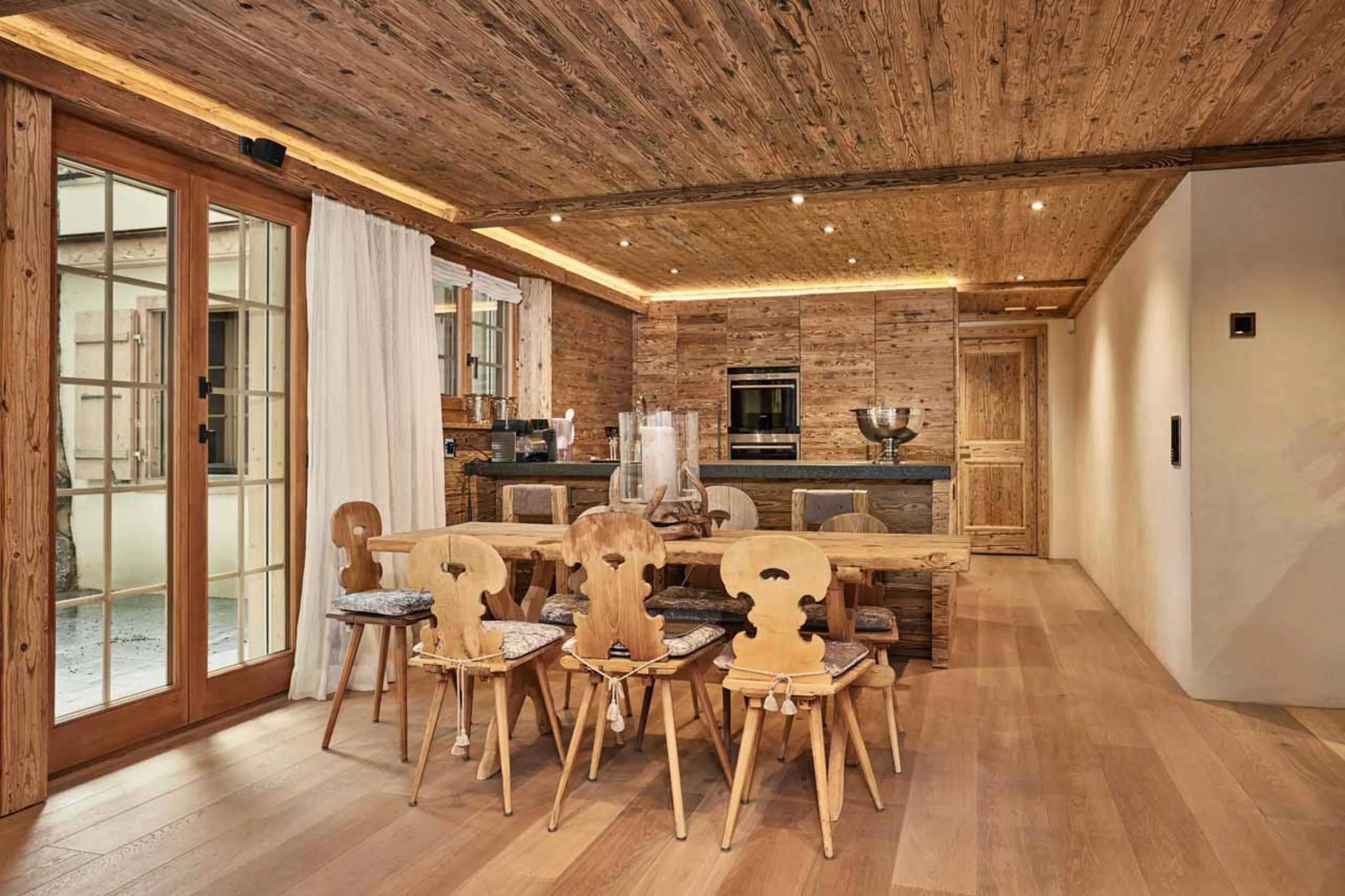 Dining area and kitchen at Chalet Amorica in Gstaad
