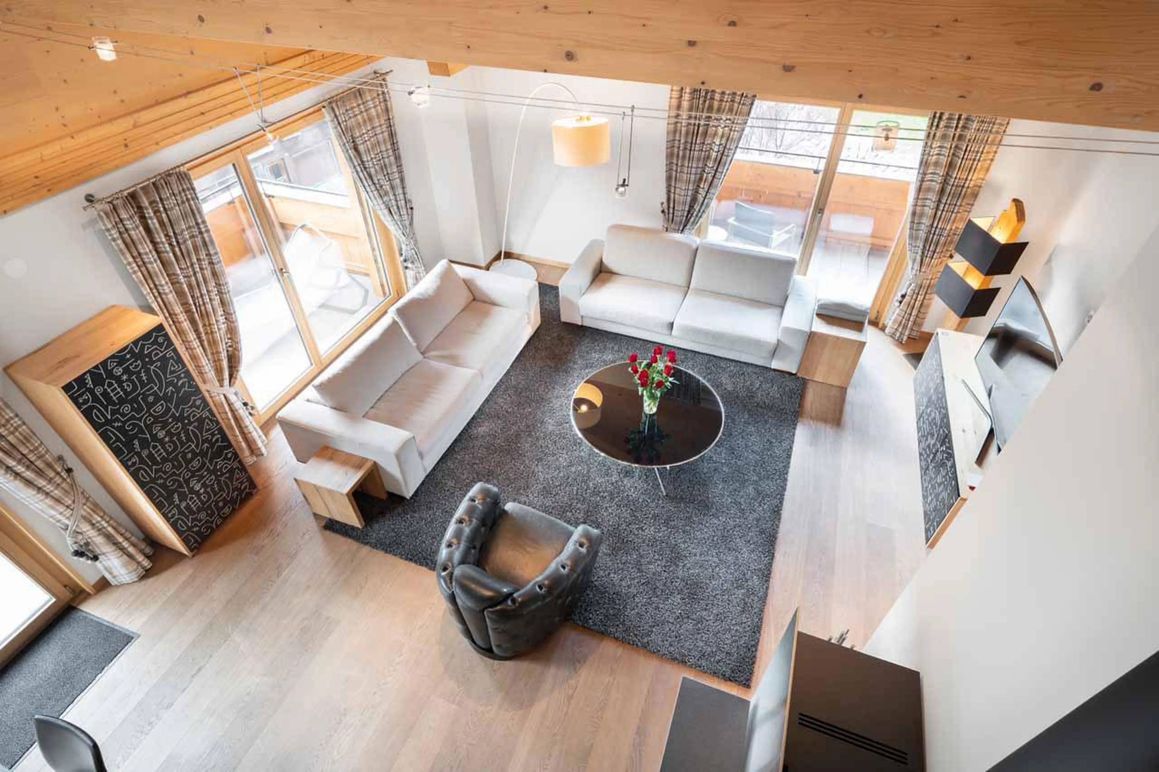 Living space viewed from bedroom mezzanine at Apartment Antara in Grindelwald