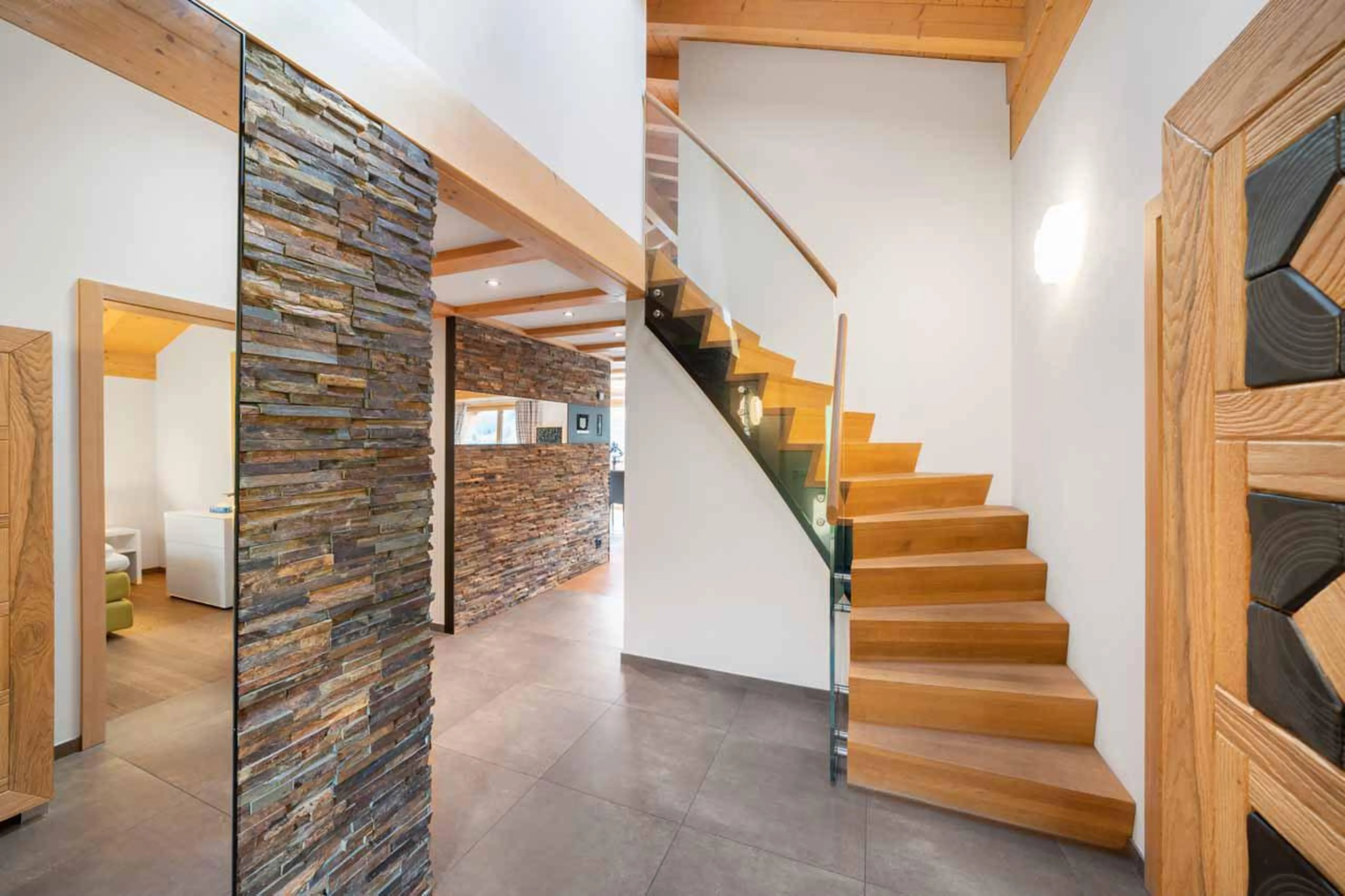 Stairs leading to en-suite bedroom on mezzanine at Apartment Antara in Grindelwald