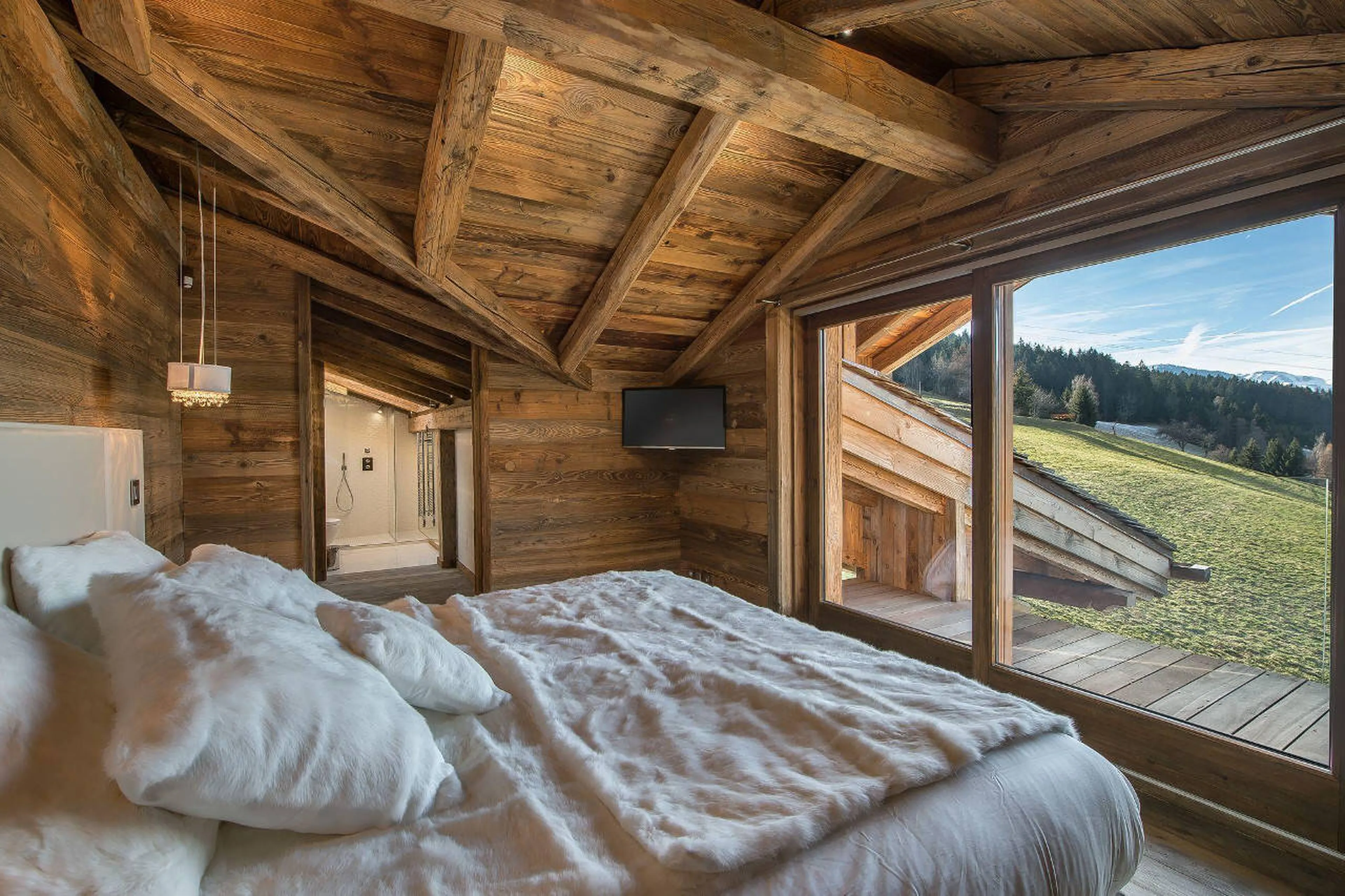 Inviting queen-size bed in Chalet Ararat in Megeve