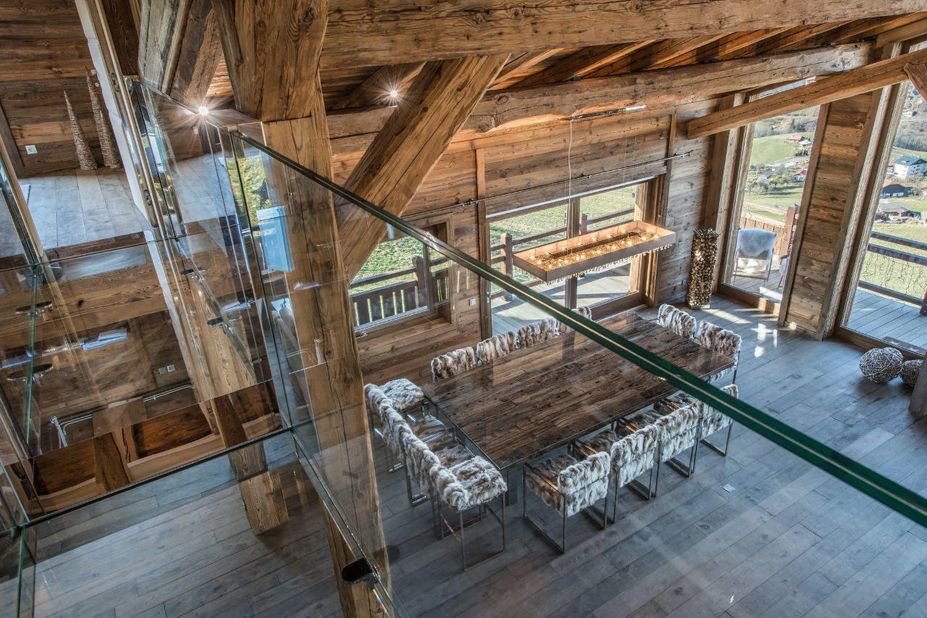 Unique glass walkway above living area of Chalet Ararat in Megeve