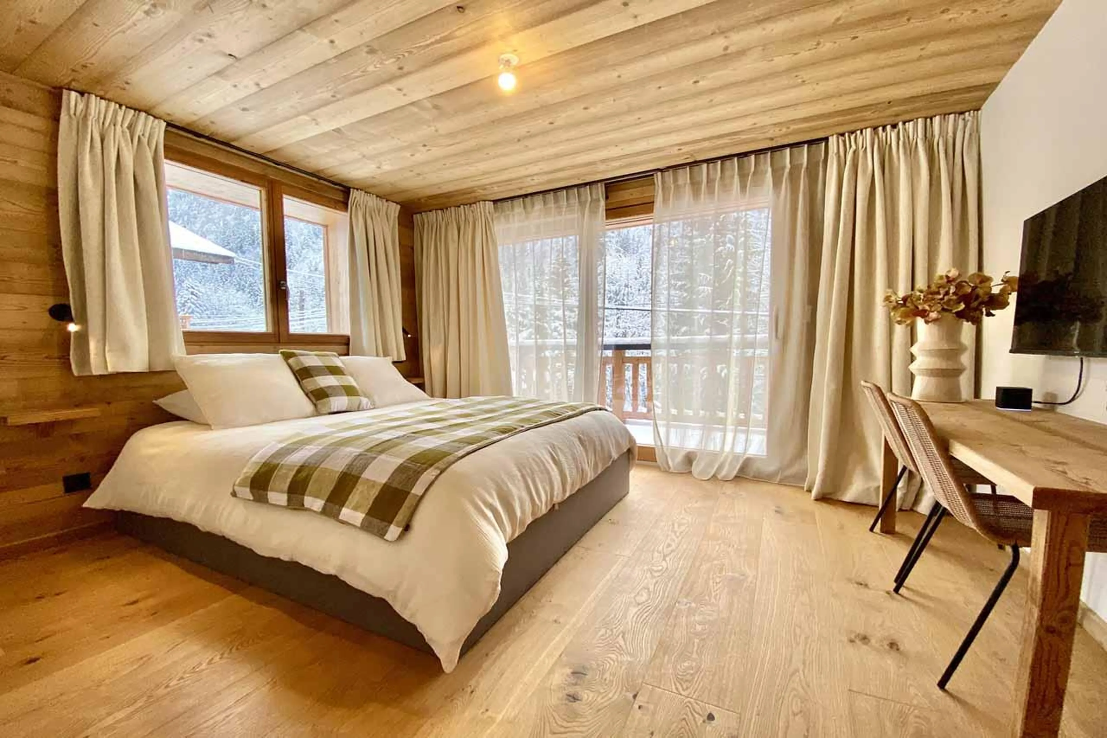 Double bedroom with desk and TV in Chalet Asgard, Morzine