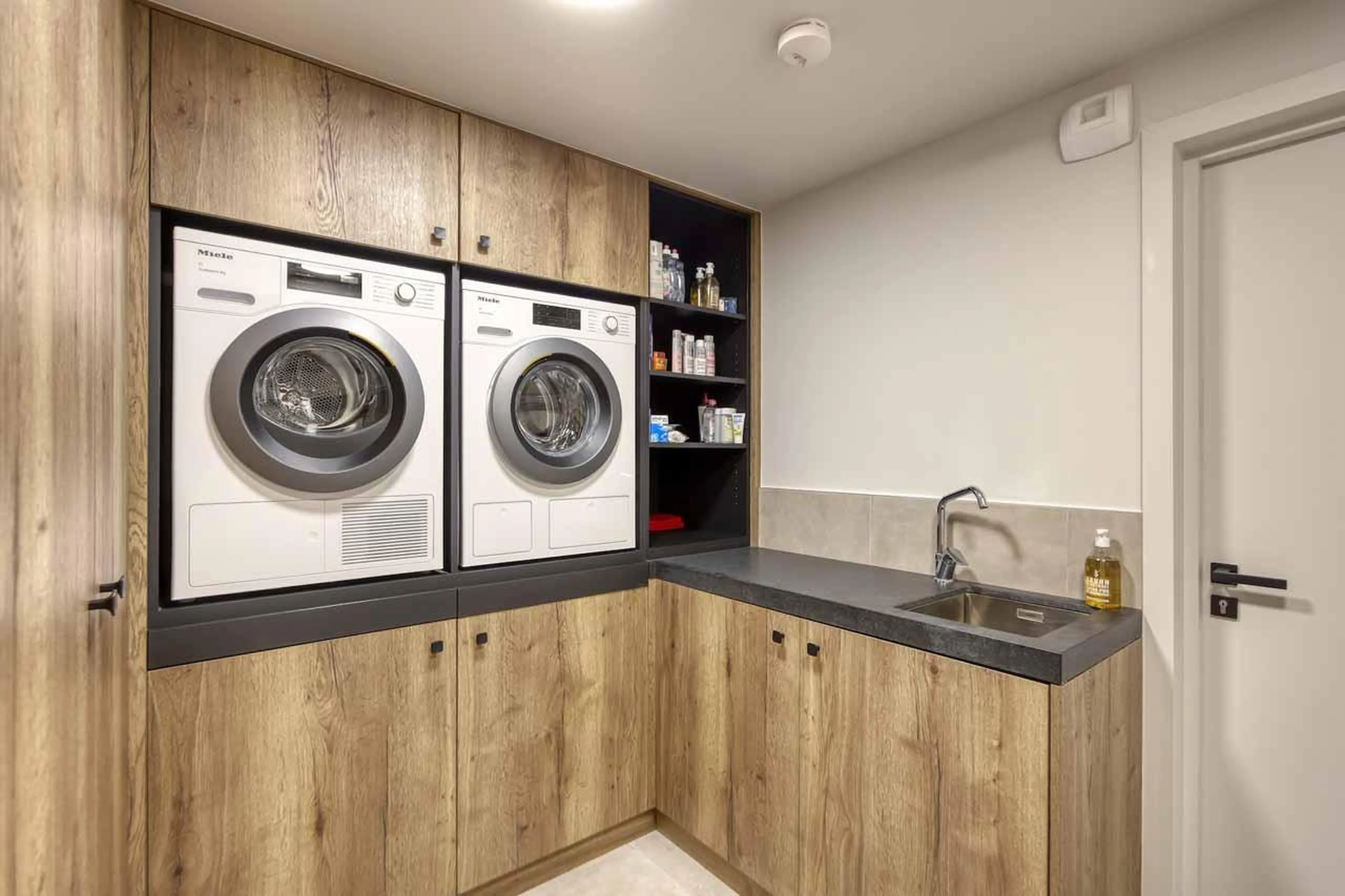 Built-in cupboards and washing machine and dryer with in Chalet Aspen, Megeve