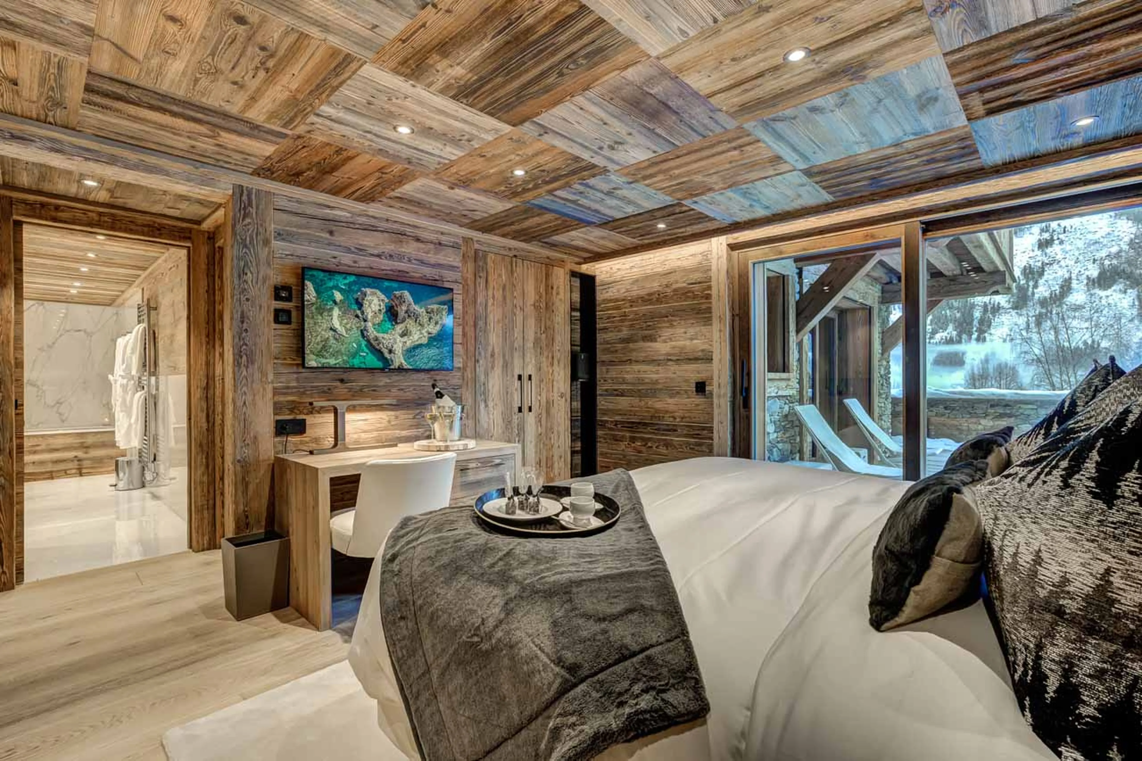 TV in bedroom one at Chalet Azurite in Chamonix