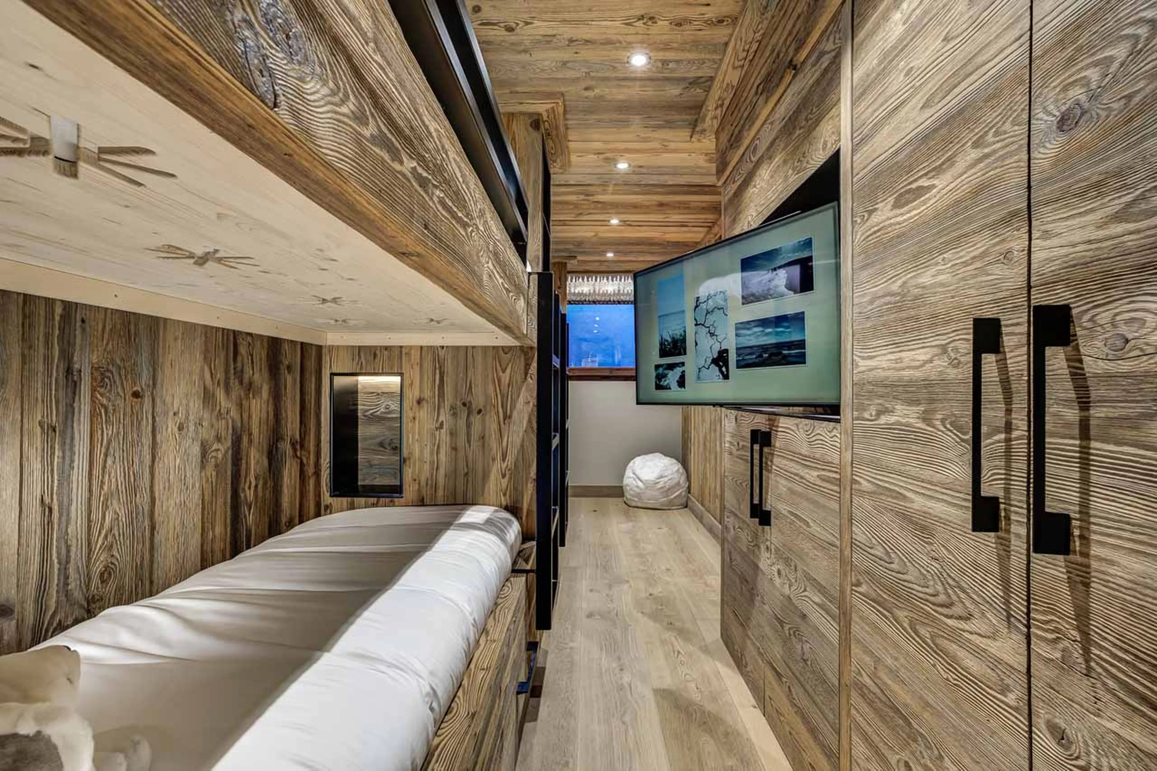 TV in bunk room at Chalet Azurite in Chamonix